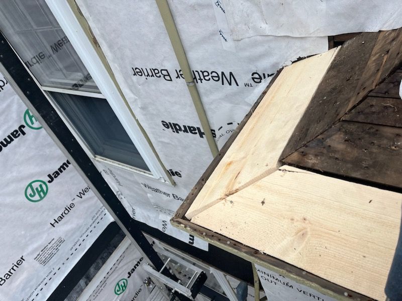 White cedar shingles and windows in Wayland, MA by UBrothers Construction