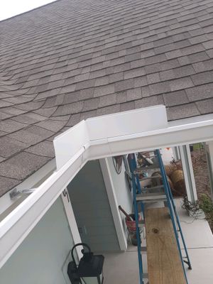 Gutter Installation Using White K-Style Seamless Gutters