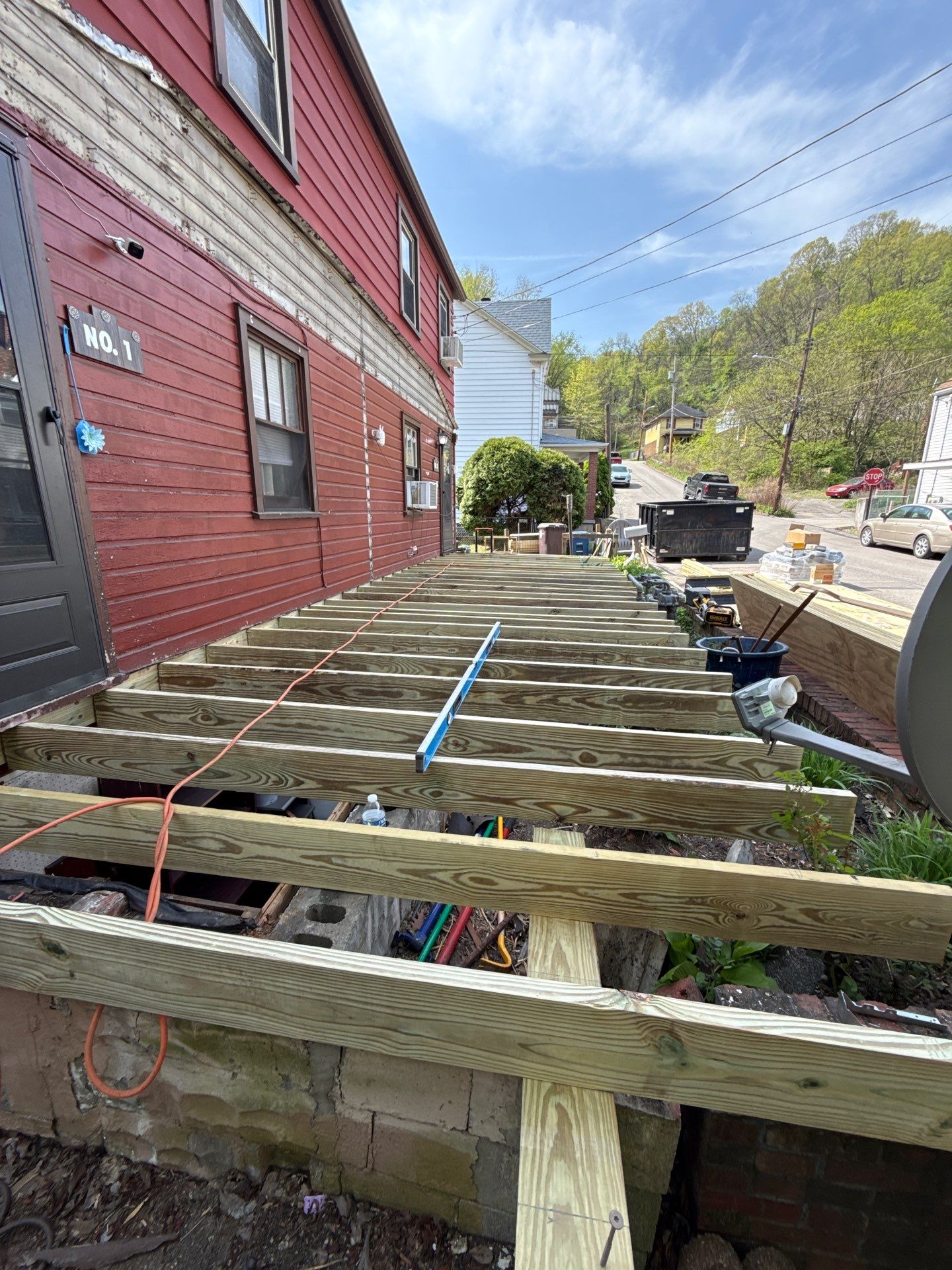 Roof sunspace deck  by Cousins Roofing Siding & Decks