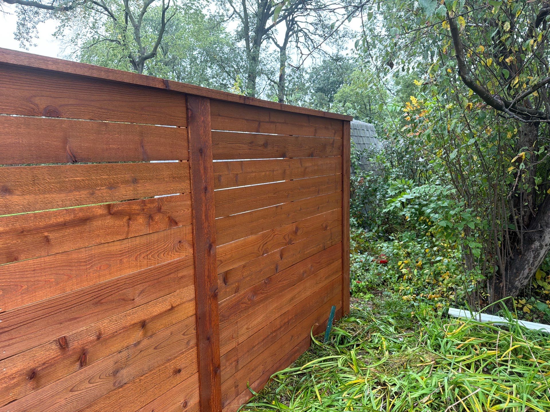 Stained Horizontal Cedar Wood Privacy Fence in Cedar Falls by Perfect Picket Fence and Stain