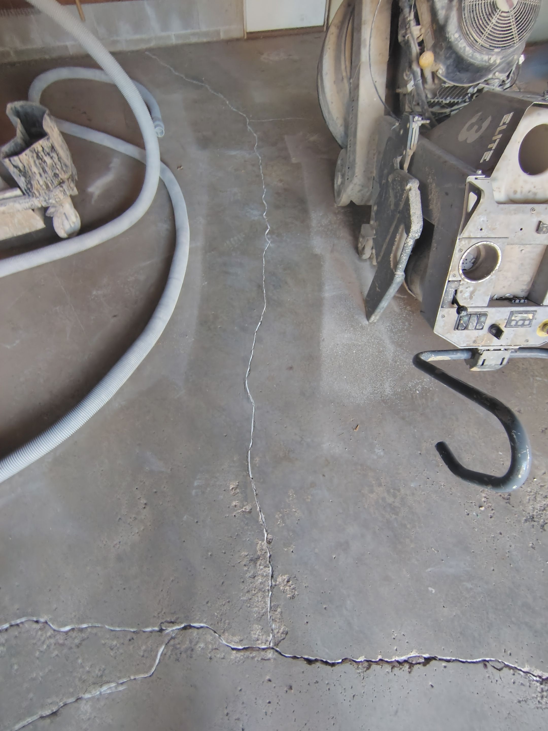 Sioux Falls Garage Epoxy Floor Installation and Concrete Crack Repair by Select Painting, Coatings & Garage Cabinets