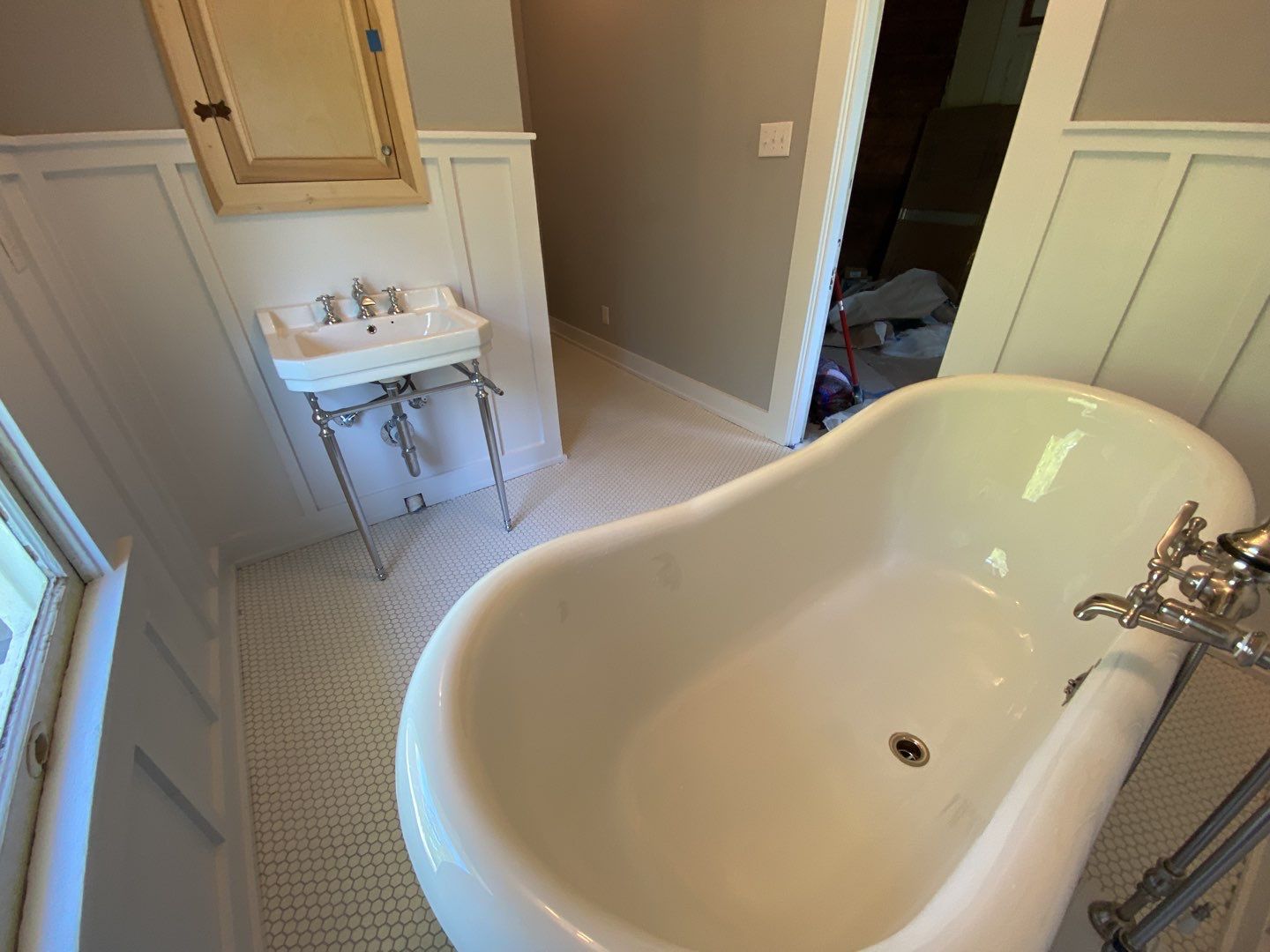 Historic Home Built in 1900 Bathroom Remodel by SLM General Contractors & Roofing