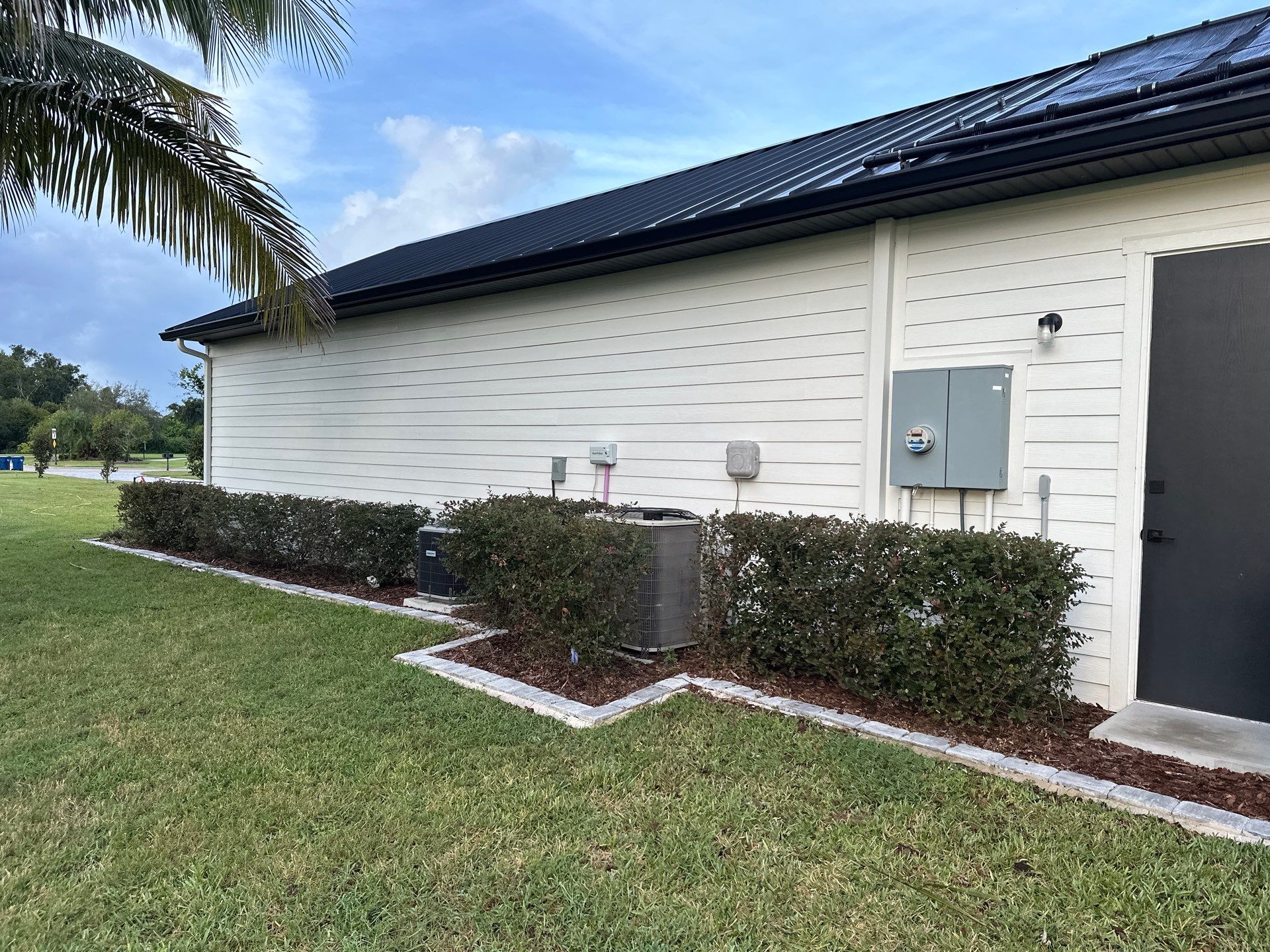 Complete Two-Story House Wash and Driveway Cleaning in Winding River Community, Bradenton, FL by Sunshine AquaWash