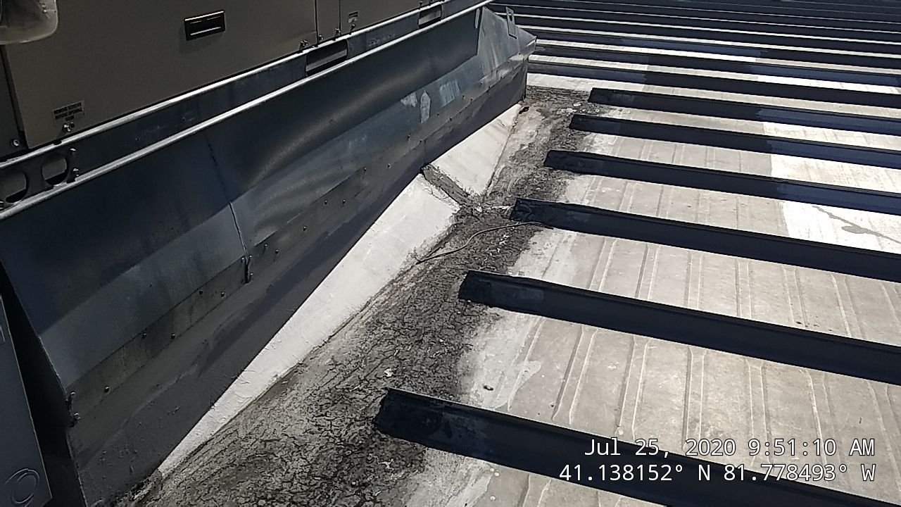 Commercial Metal Roof Coating by Gold Star Roofing LLC
