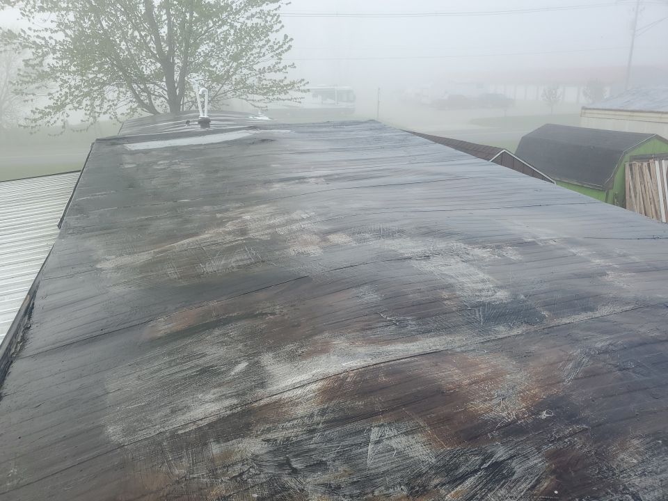 Residential Roofing Installation using 60 mil rubber roof  by Nitro Roofing and Construction