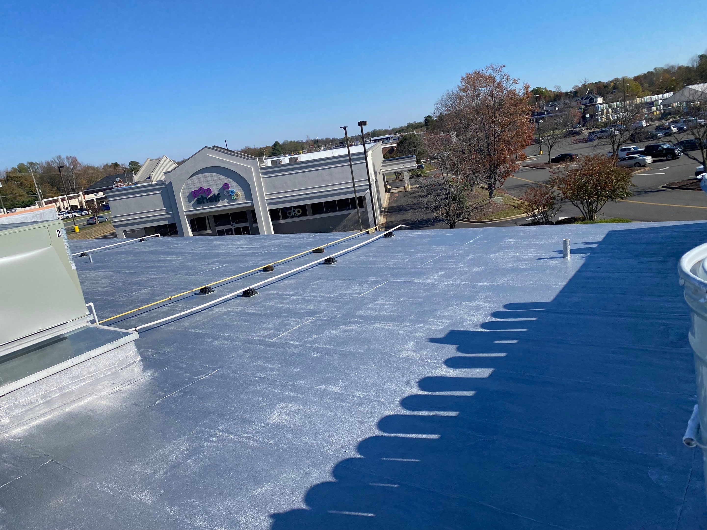 Commercial Coating using Poly Urerthane and Silicone Coating by Just In Time Roofing and Restoration