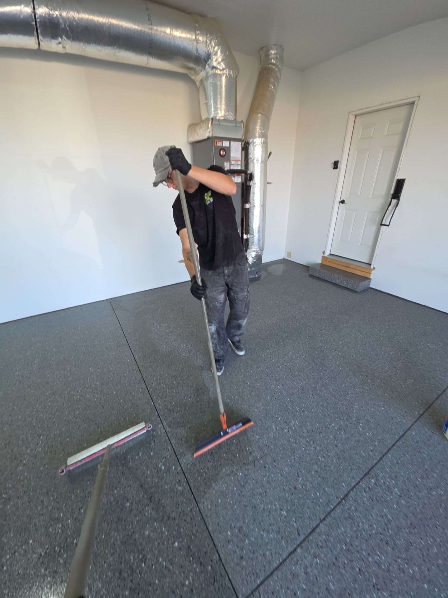 Polyaspartic Garage Floor Coating With Slate Hybrid Flake in Davenport by Croc Coatings, LLC