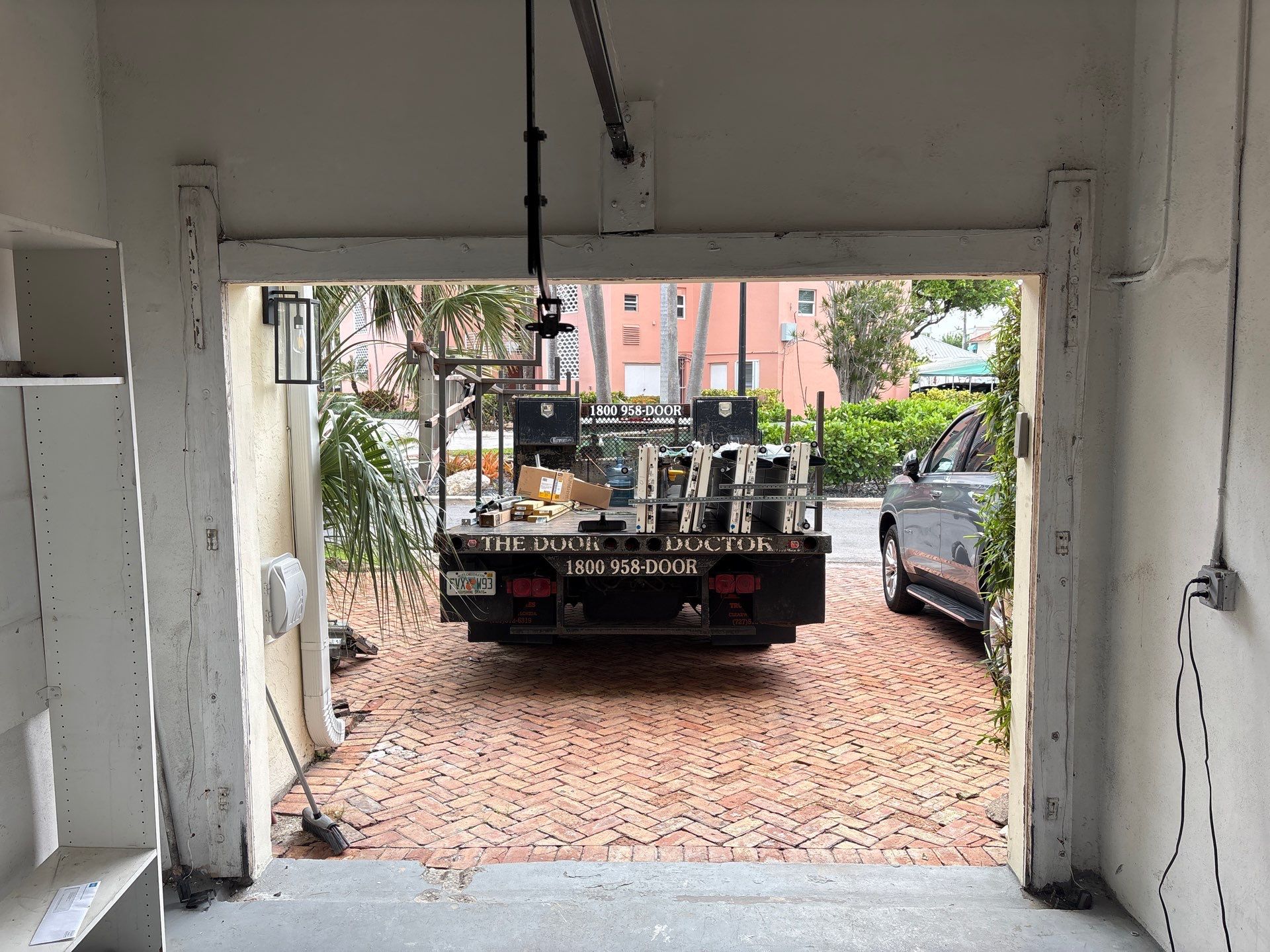 Clopay Modern Steel Garage Door Installation in Fort Lauderdale by The Door Doctor of South Florida, Inc.