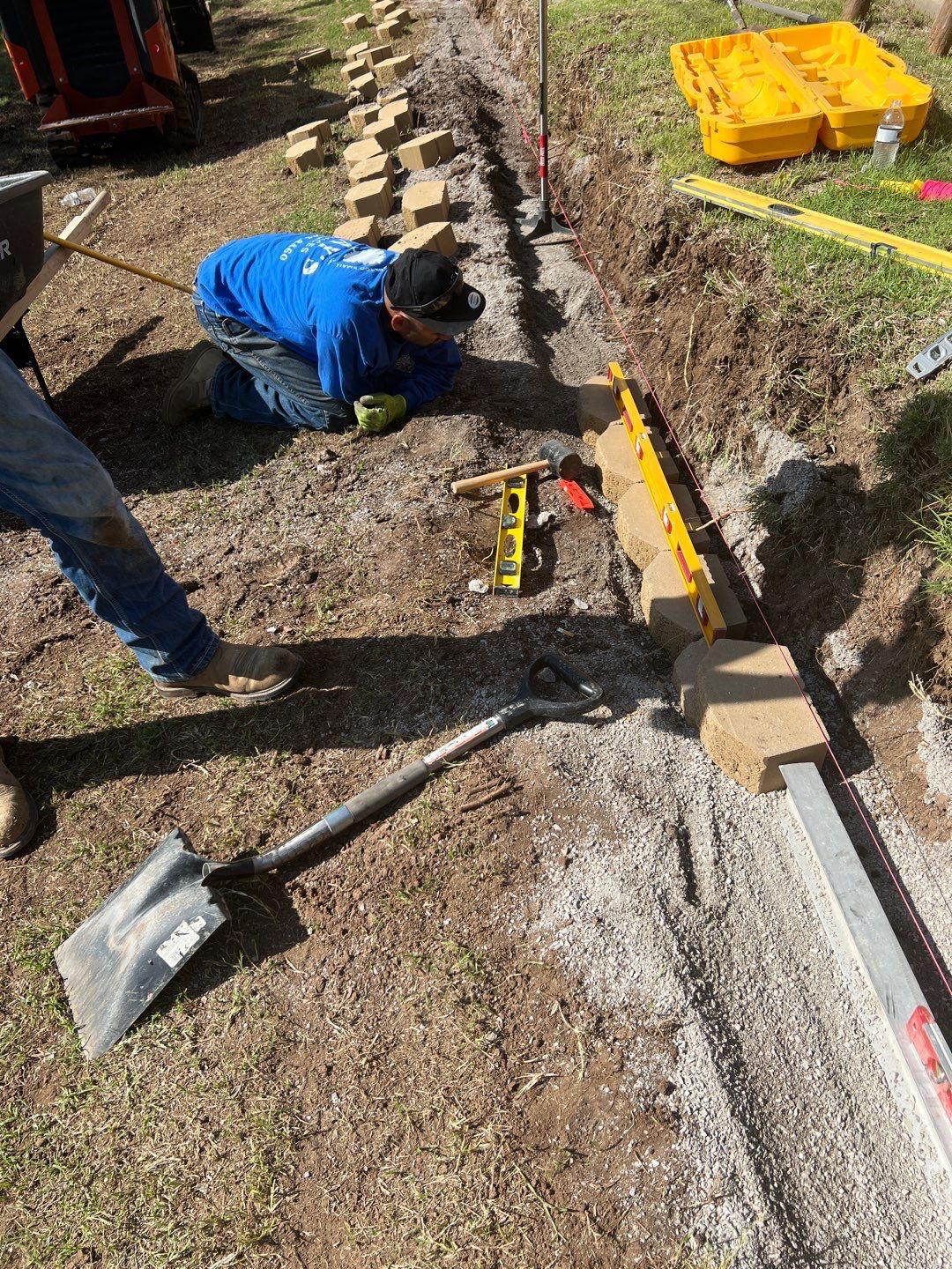 Retaining Wall using Rocks by Clays Services Inc