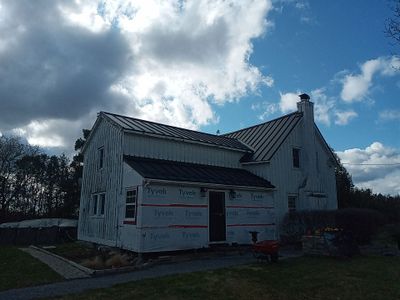 Residential Roofing Installation using 16" Standing Seam Panels