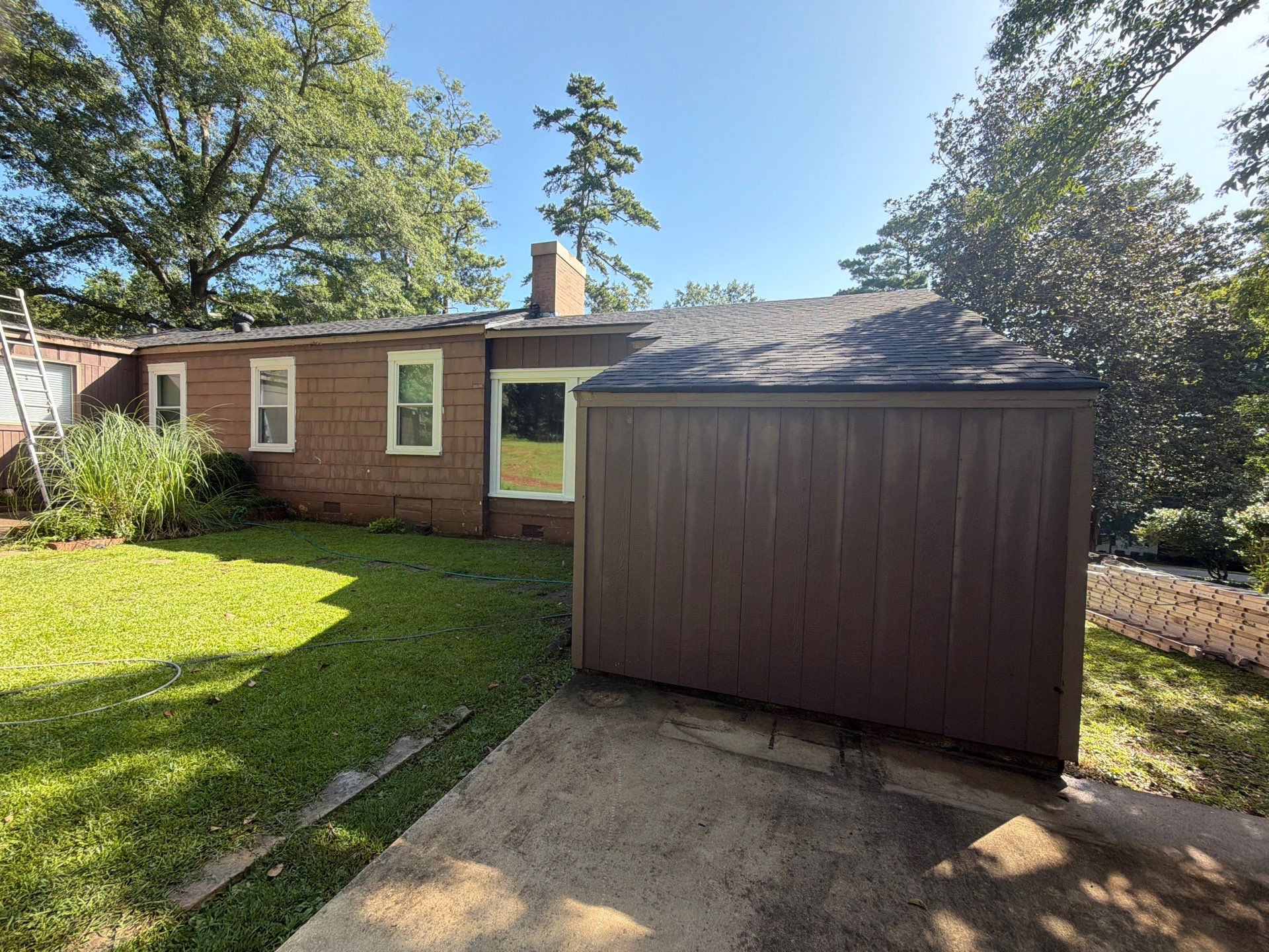 Full Exterior Repaint with Navy Blue and White Trim by Swift Home Renovations