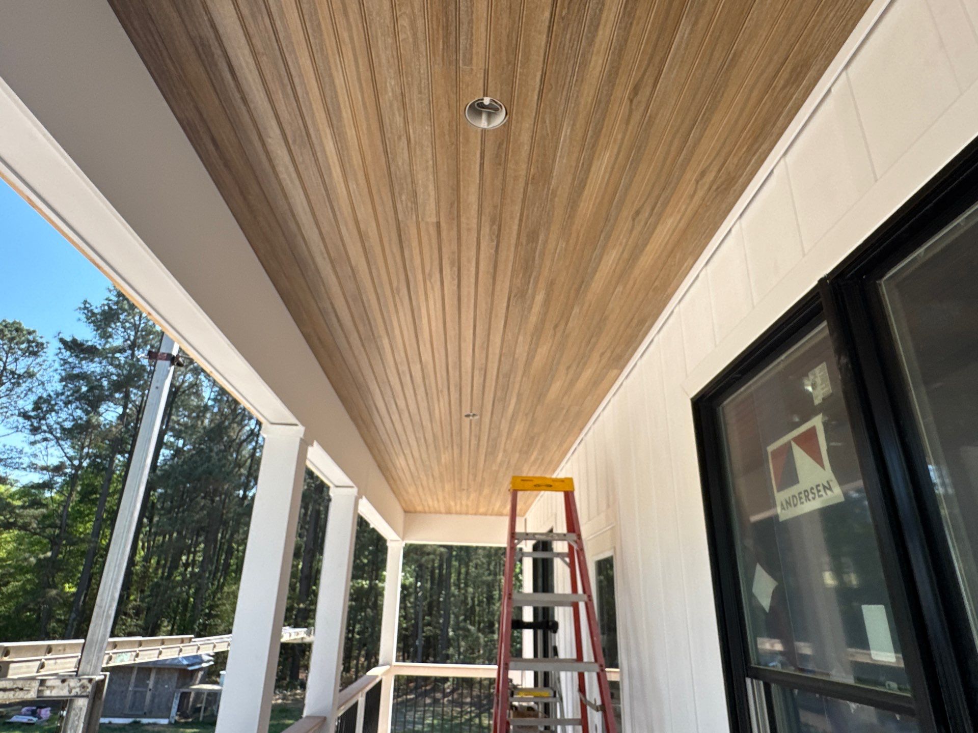 Two-Story Custom Home With Board and Batten Siding by Cade Construction