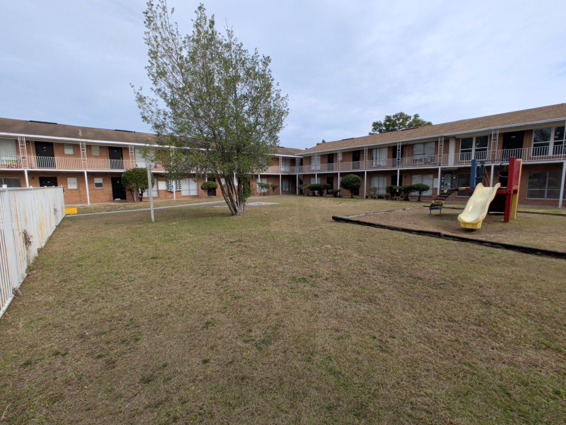 Apartment Landscape Cleanup & Ongoing Grounds Maintenance — Cimarron Apartments (Arlington) by Harmoni Home Services