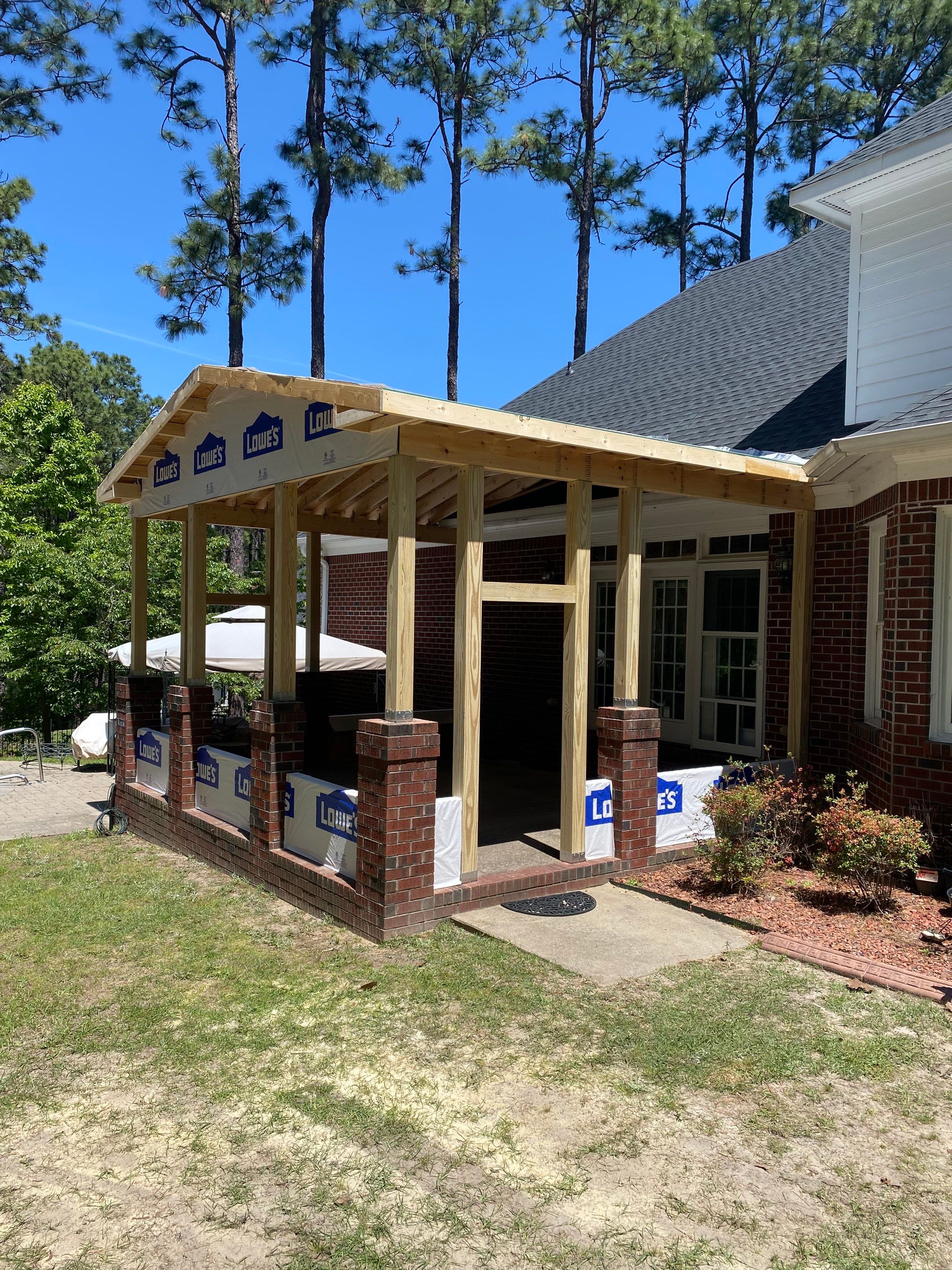 Custom Screened-In Porch Addition with Open Gable Roof in Fayetteville by The Remodeling Company