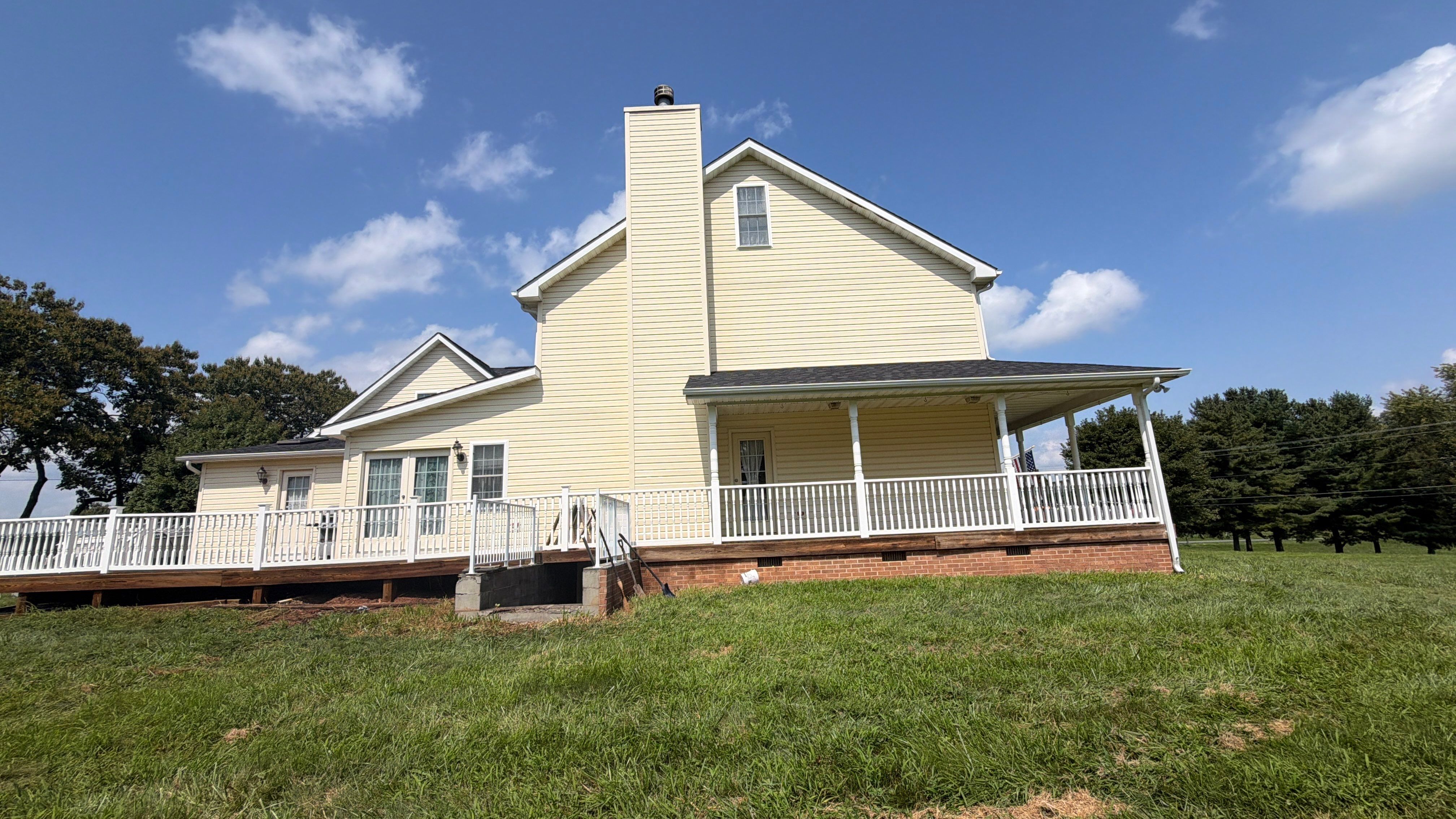 Vinyl Siding House Washing and Wood Deck Restoration in Carroll County by Baltimore Pressure Washers Inc.