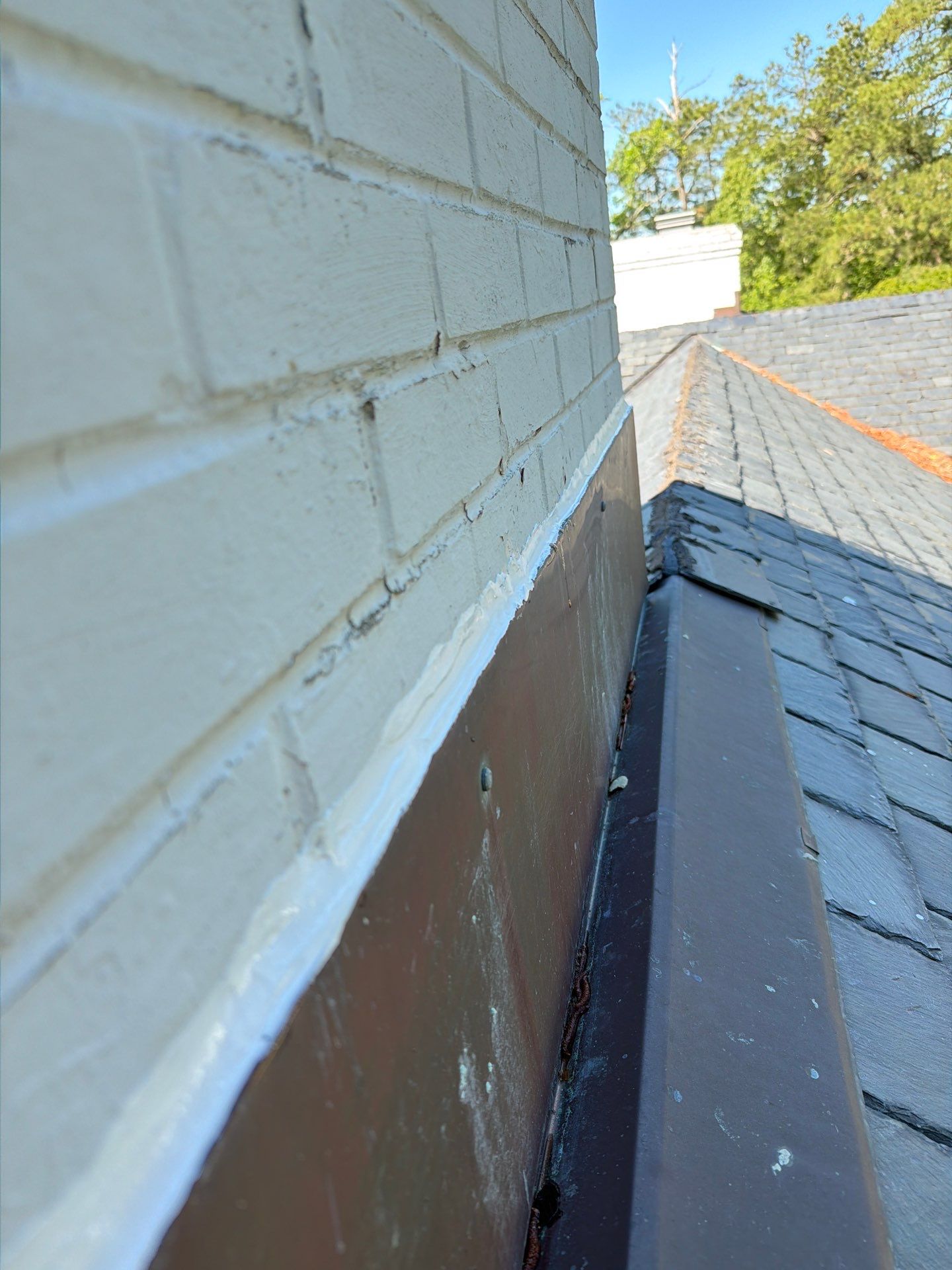 Historical Slate Roof Repair and Chimney Flashing Restoration in West Point by Cade Construction