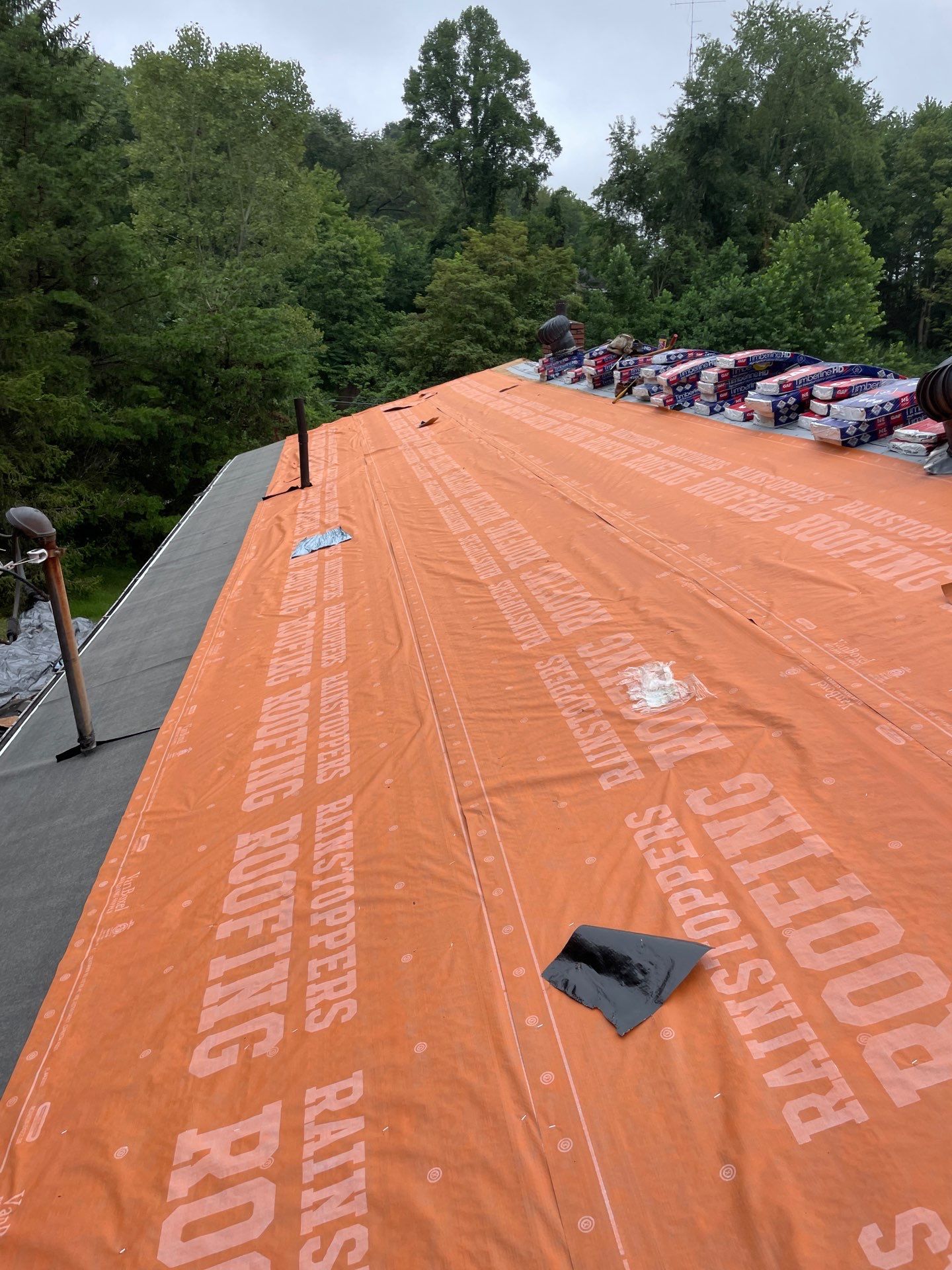 Residential Roofing Installation using GAF Timberline HDZ Charcoal by Rainstoppers Roofing