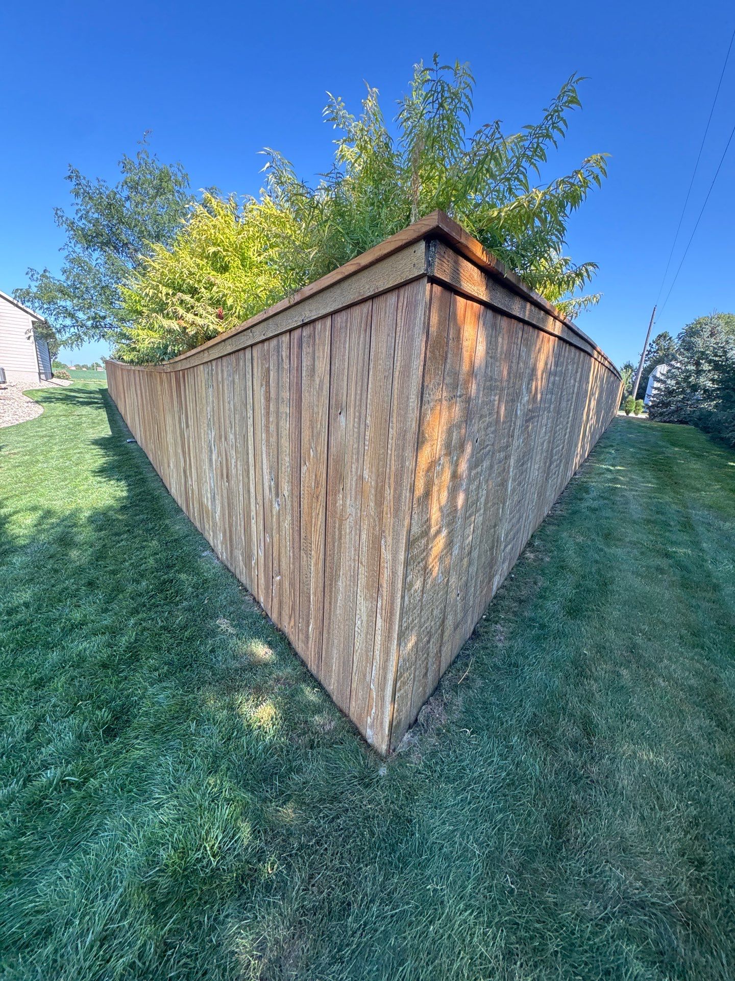 Custom Privacy Fence and Paver Patio Installation in Sioux Falls by Select Painting, Coatings & Garage Cabinets