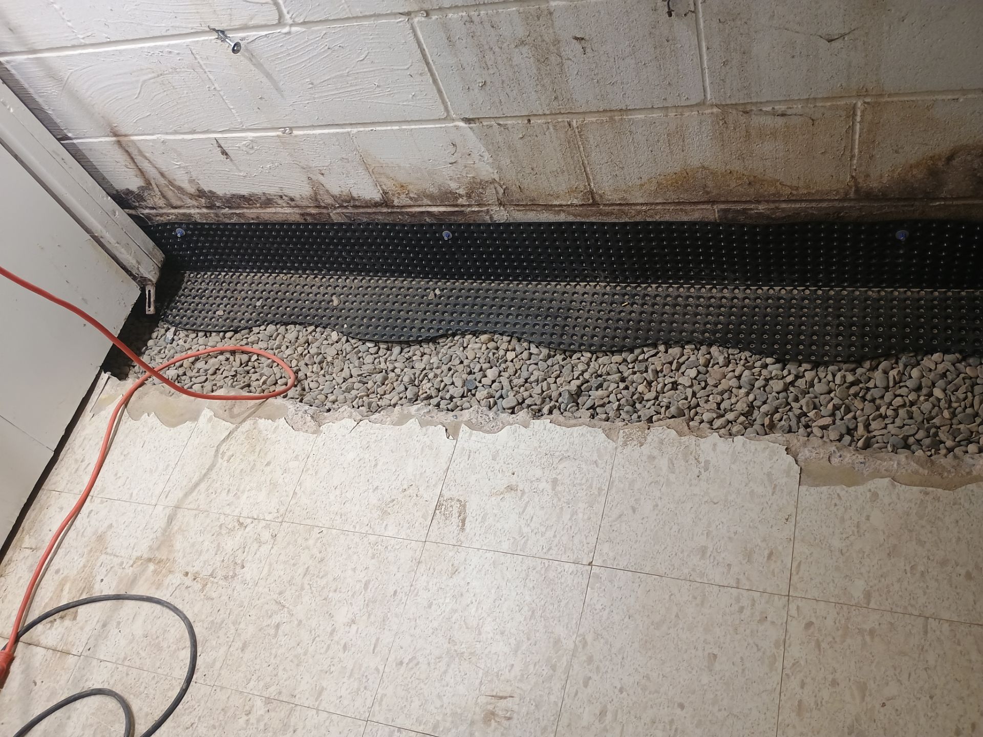 Interior Drain Tile Installation in Columbia Heights, MN by Waterproofing Northeast