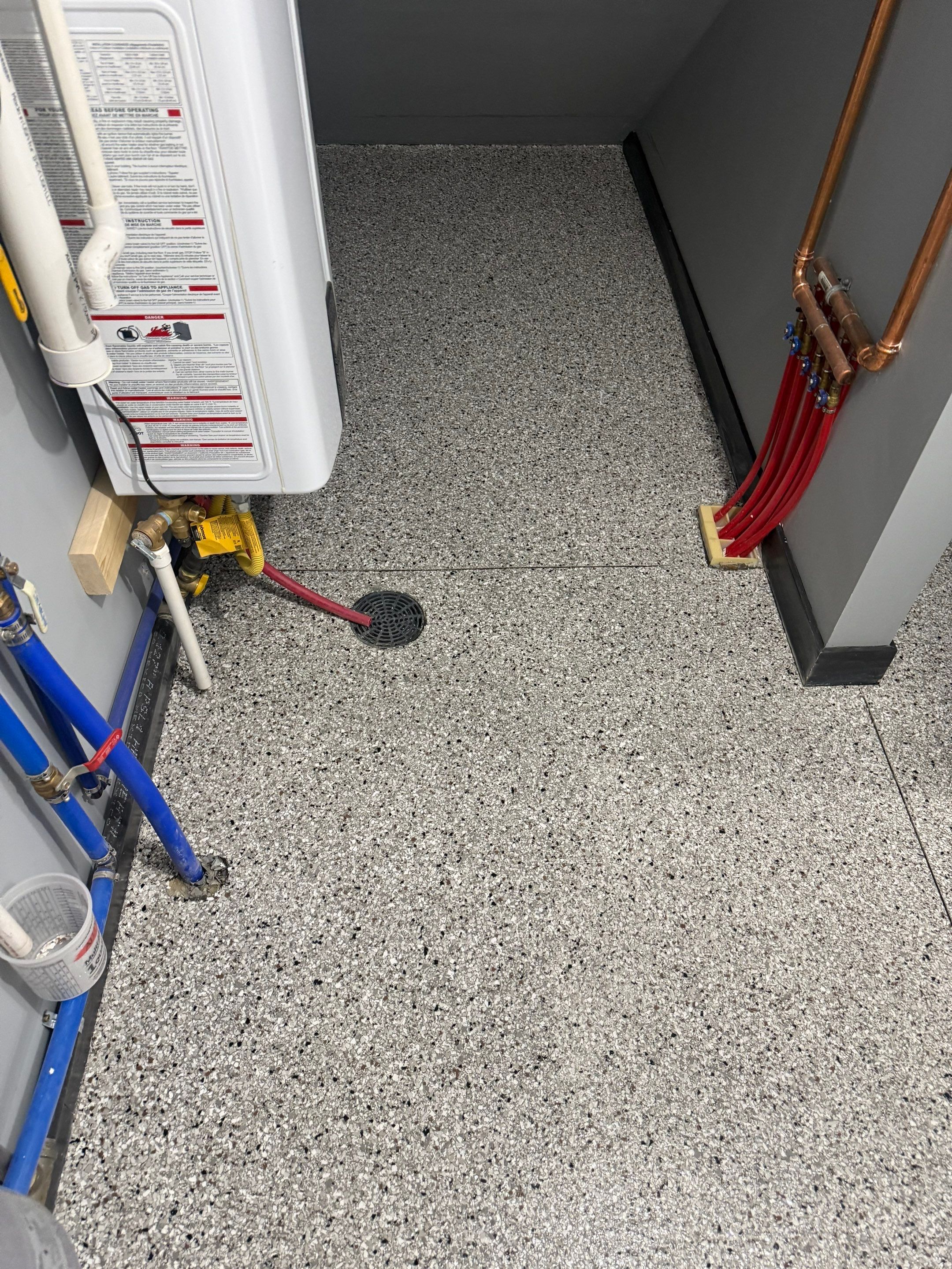 Polyaspartic Garage Floor Coating with Decorative Flake in Wentworth by Select Painting, Coatings & Garage Cabinets
