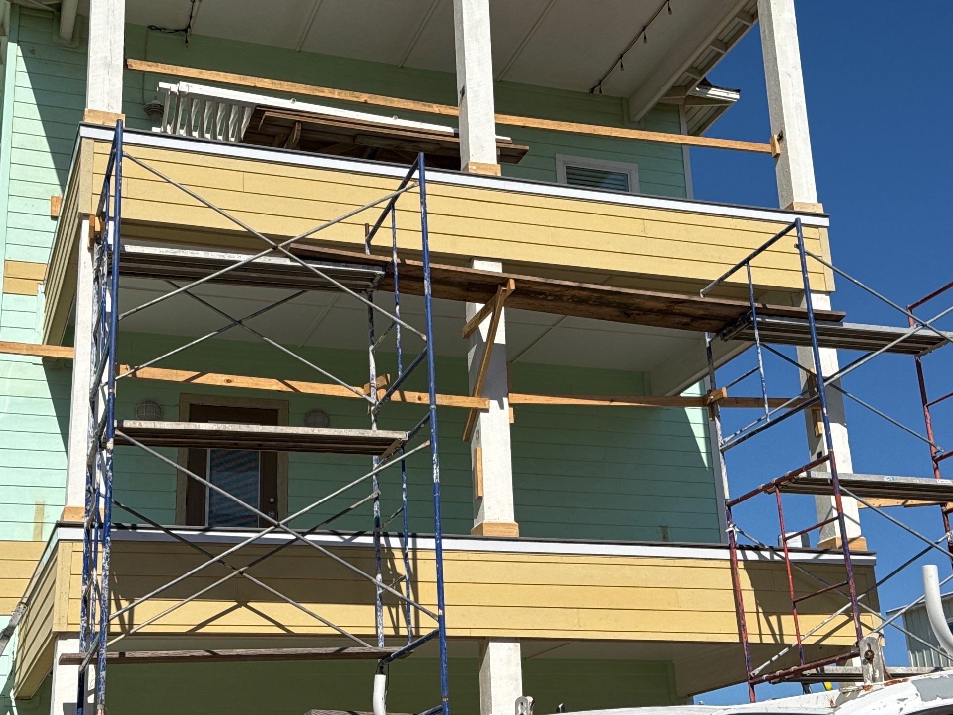 Port A Beach Front Triple Threat by Bayfront Roofing and Construction