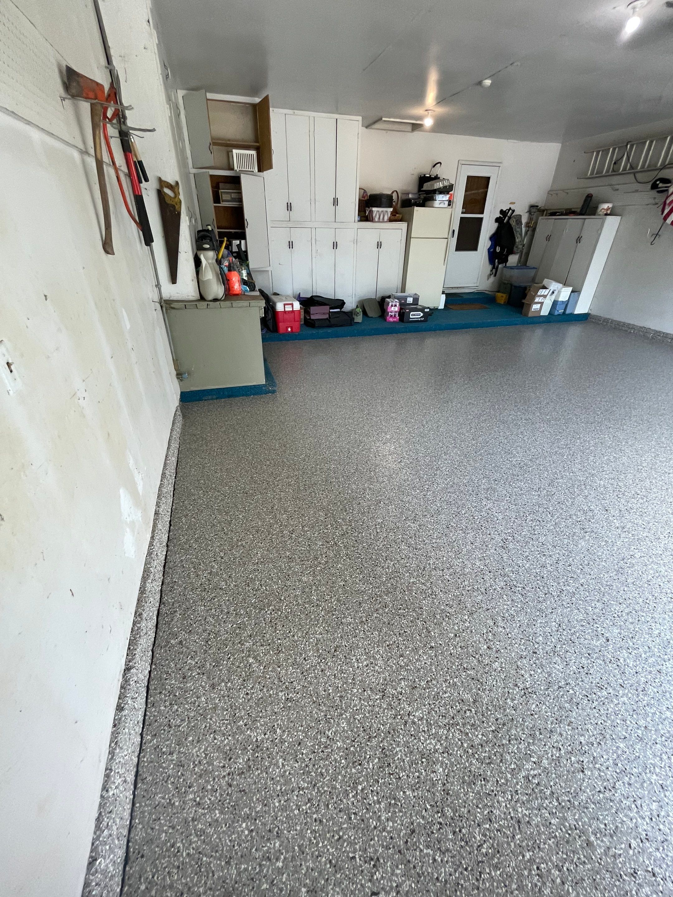 Custom Creekbed Garage Floor Coating in Sioux Falls by Select Painting, Coatings & Garage Cabinets