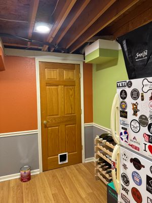 Basement Remodel with Exposed Painted Ceilings and Laminate Flooring in Mequon