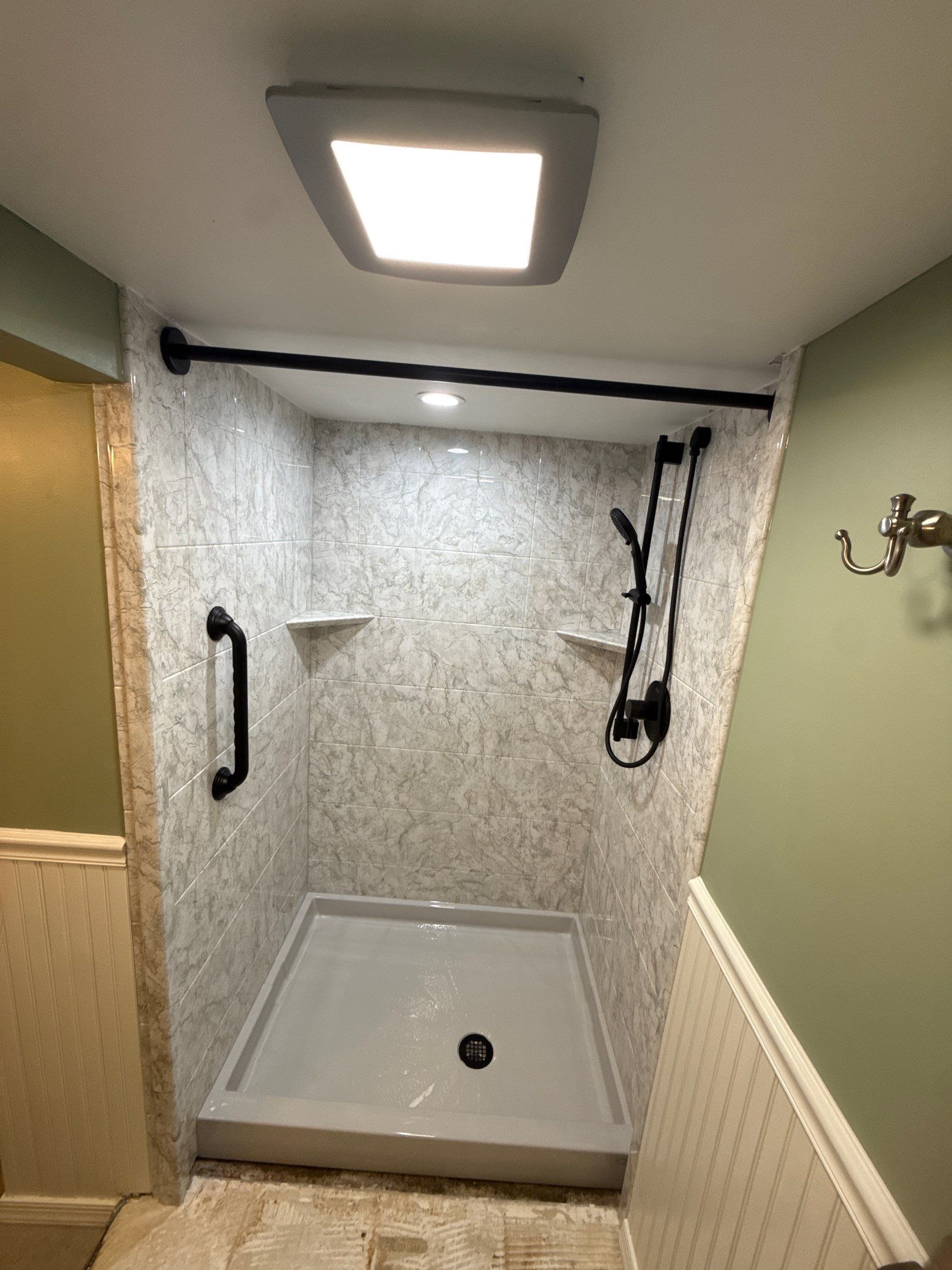 Jacuzzi Bath & Shower Remodel With Marbled Wall Panels in Sault Sainte Marie by Rainbow Seamless Systems