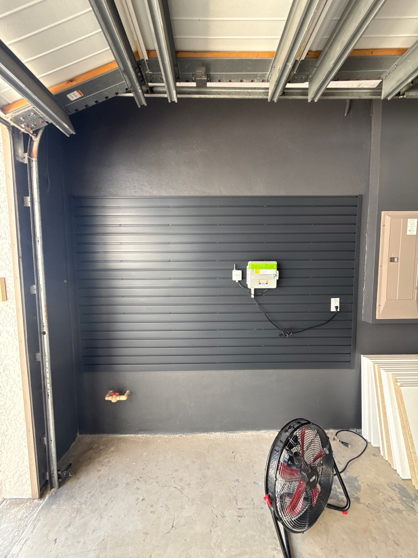 Custom Garage Makeover in Lutz Featuring Hex Lighting and Epoxy Floors by Square 1 Garage and Closet Solutions
