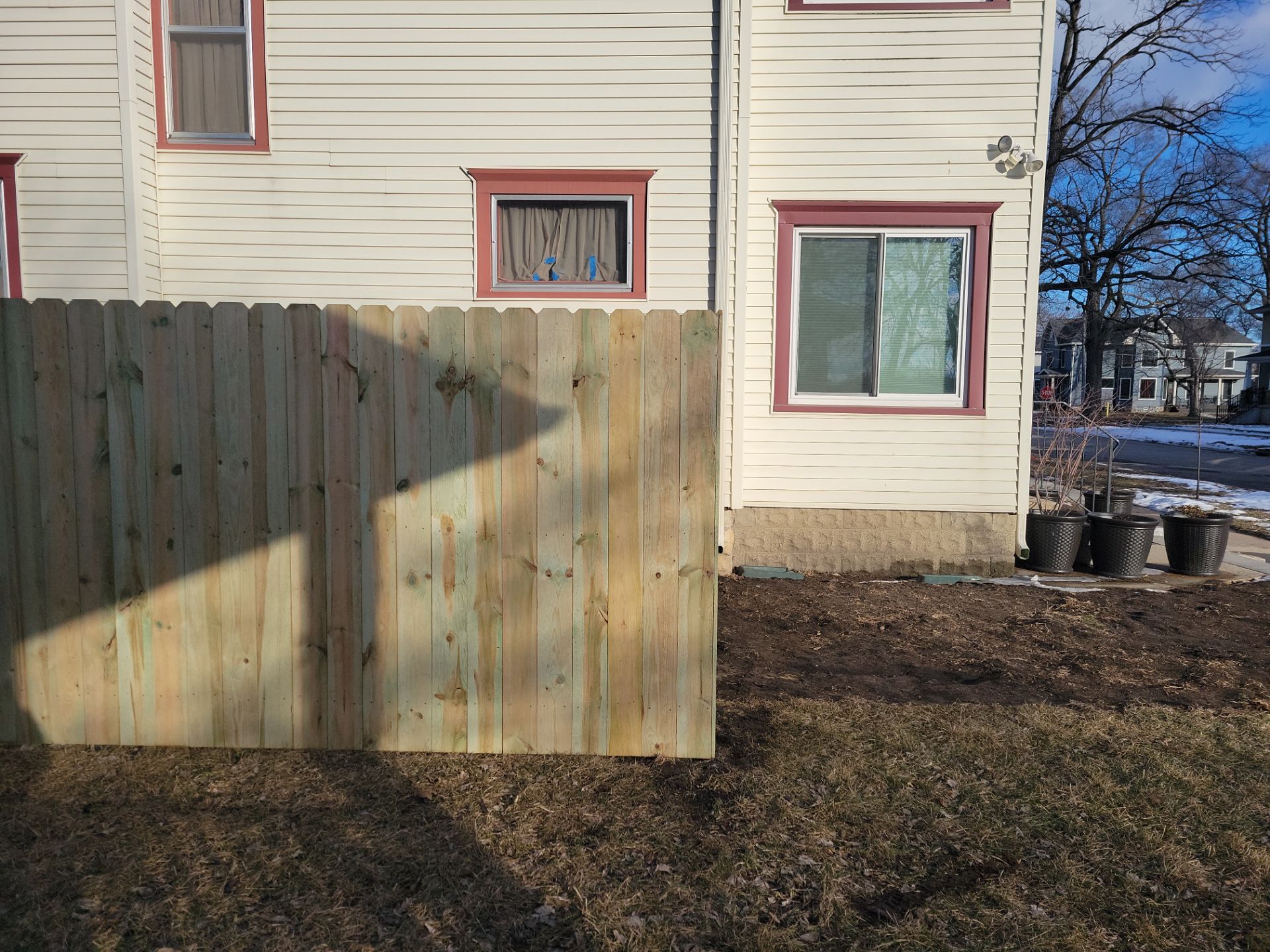 Pressure-Treated Wood Privacy Fence and Double Gate Installation in Waterloo by Perfect Picket Fence and Stain