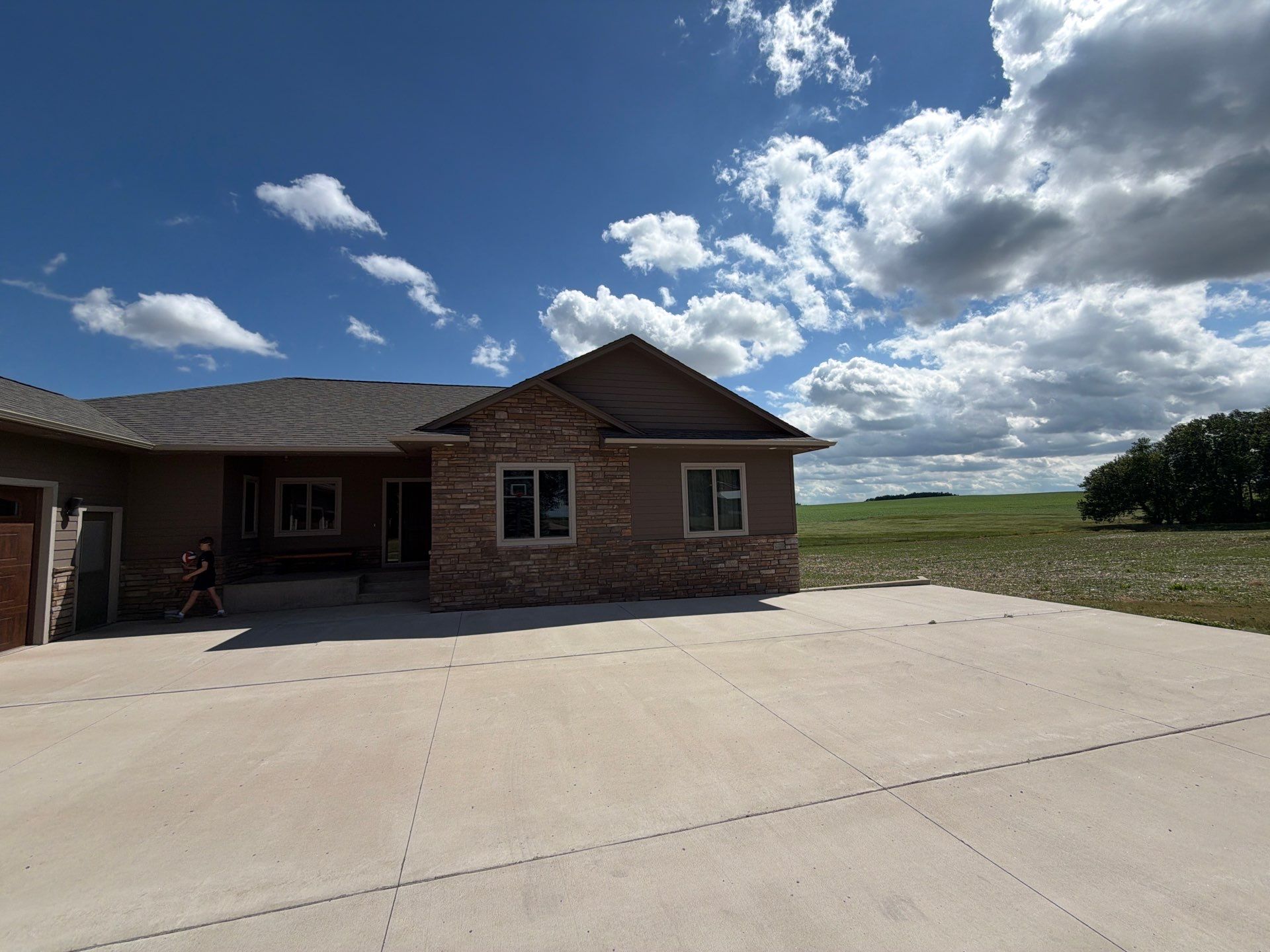 Full Exterior Siding Paint Restoration and Refresh in Garretson by Select Painting, Coatings & Garage Cabinets