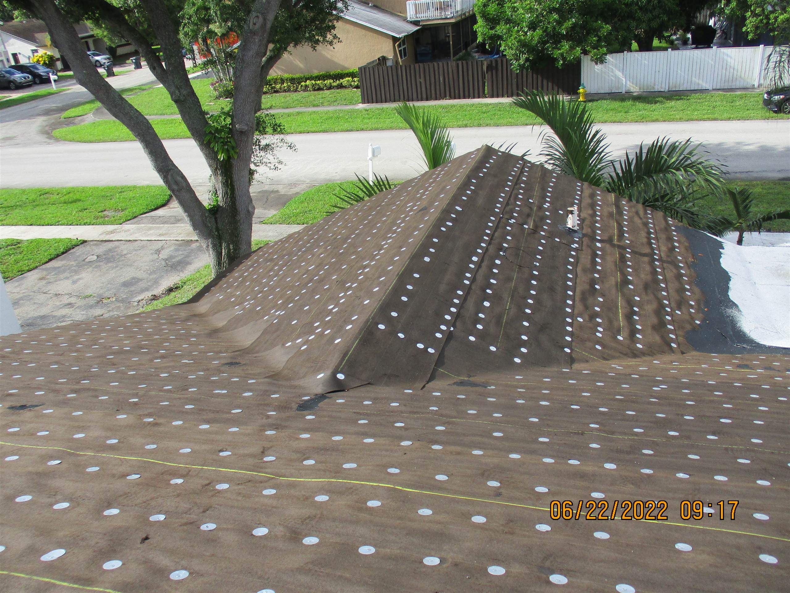 Residential Roofing Installation using 1.5" Nail Strip 24ga Solar White Kynar Coated Standing Seam Metal Panels by Morton Roofing, Inc.