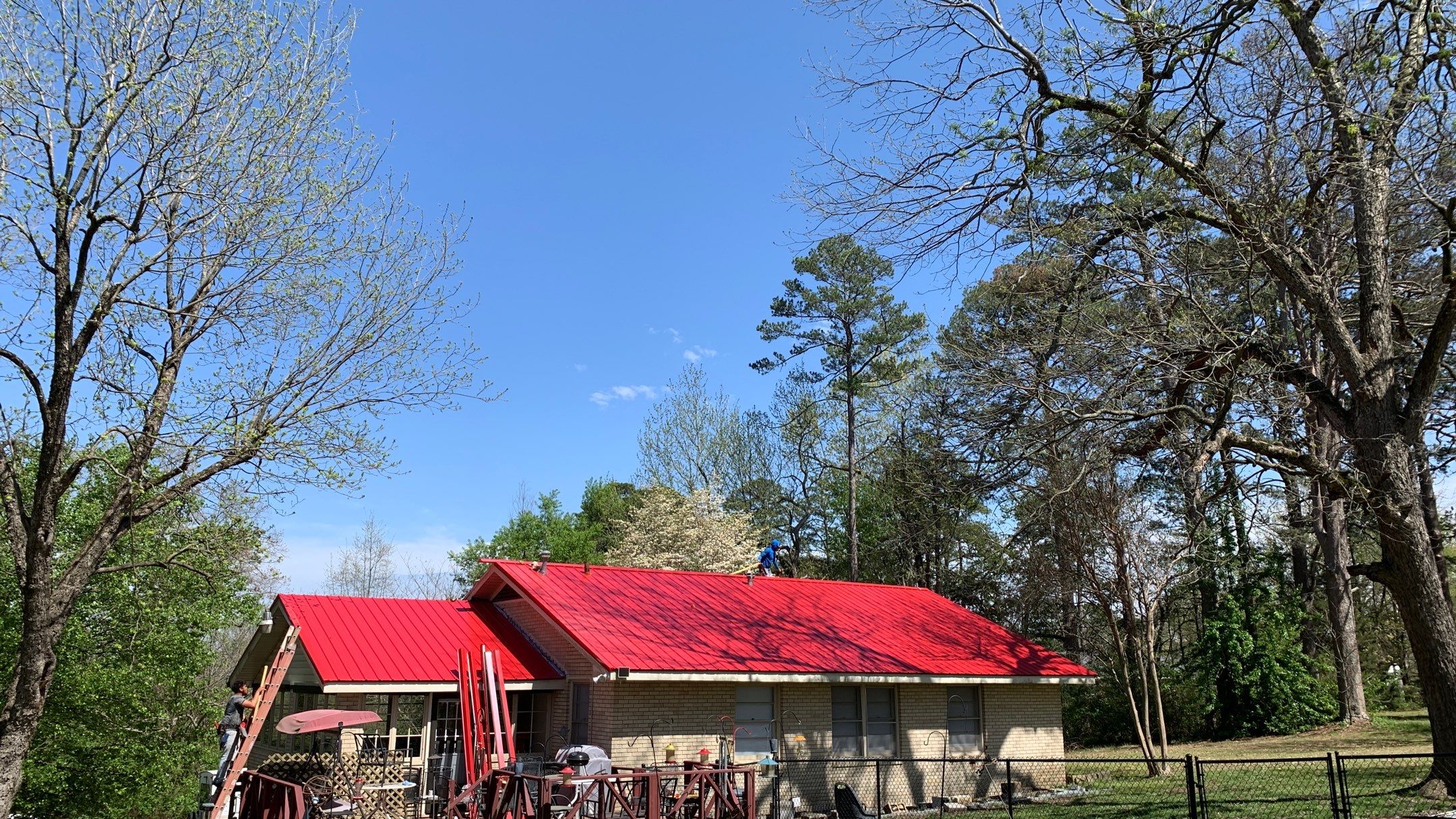 Residential Roofing Installation using 26 Gauge Colored Panels by Hostetler Roofing
