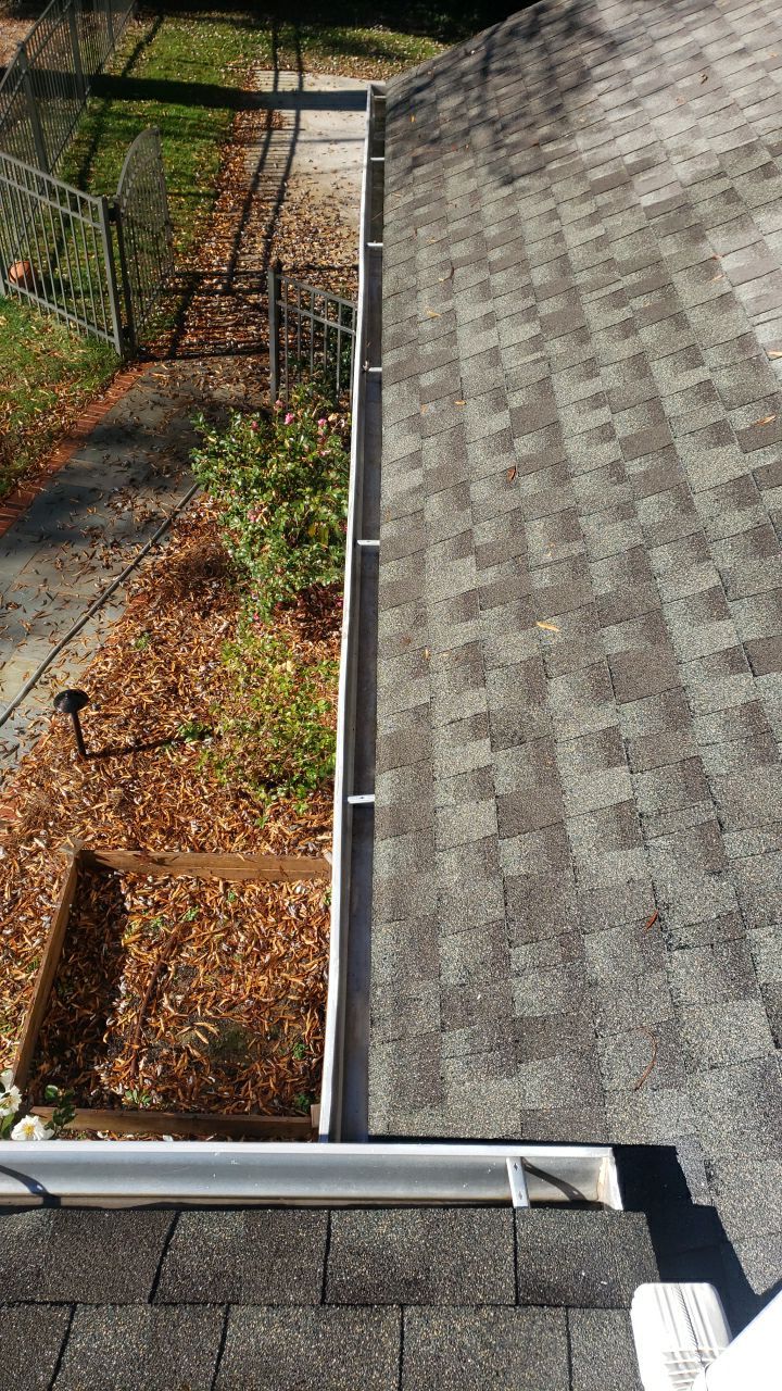 Sara Gutter cleanout using water by G&H Home Tech Pros LLC