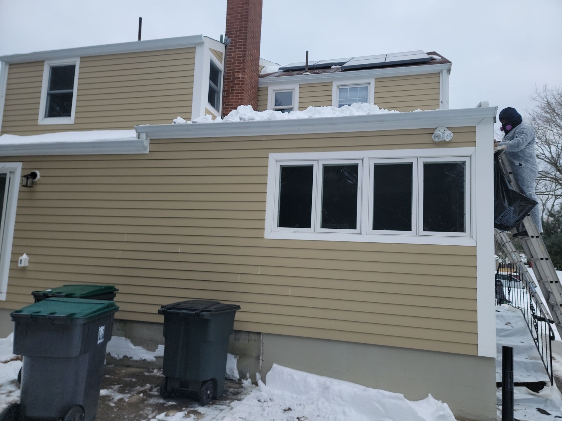 James Hardie siding, new metal roof and couple windows being installed. by UBrothers Construction