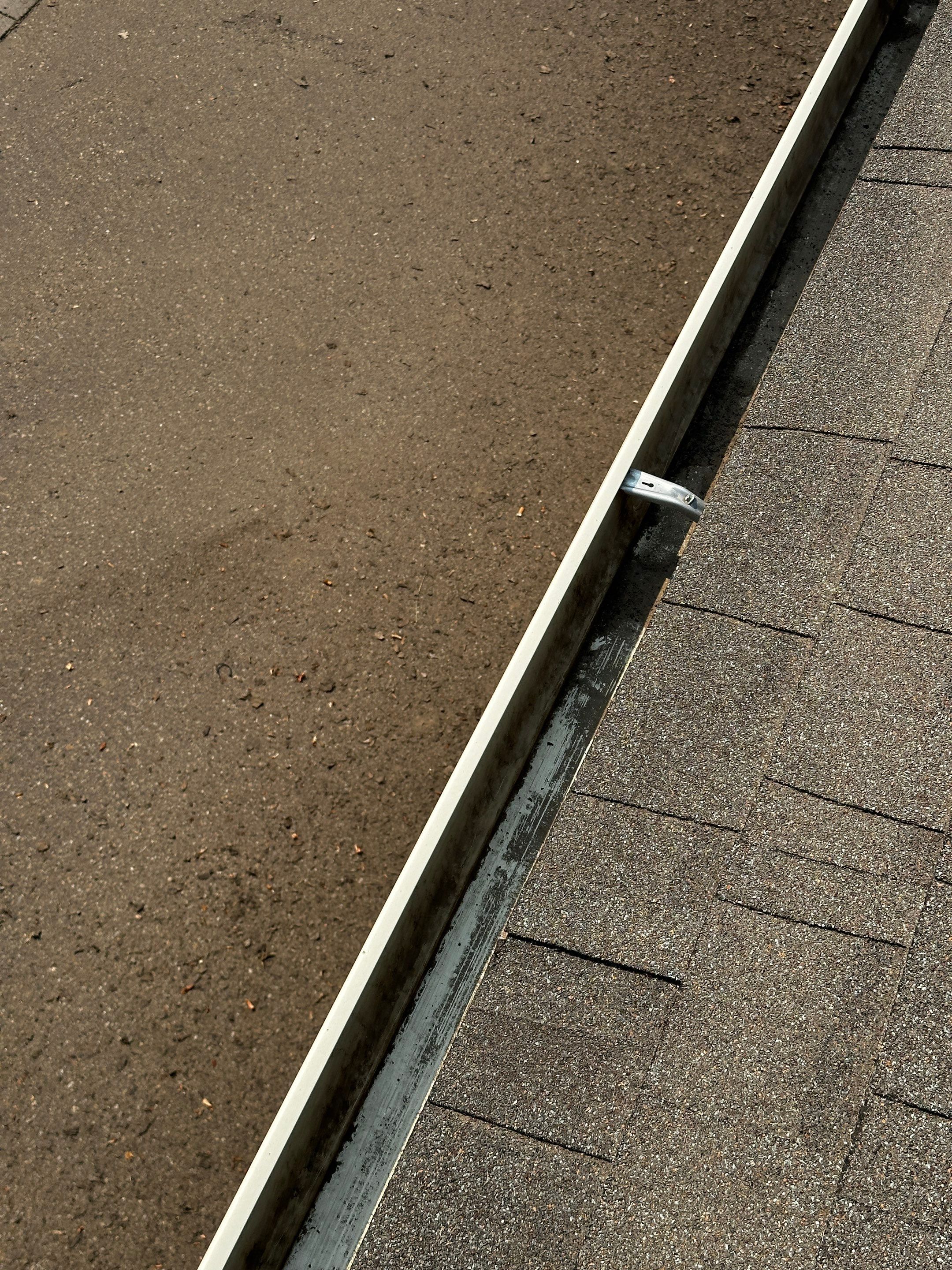 Commercial gutter cleaning Nampa & Caldwell, ID before photo with filled gutters