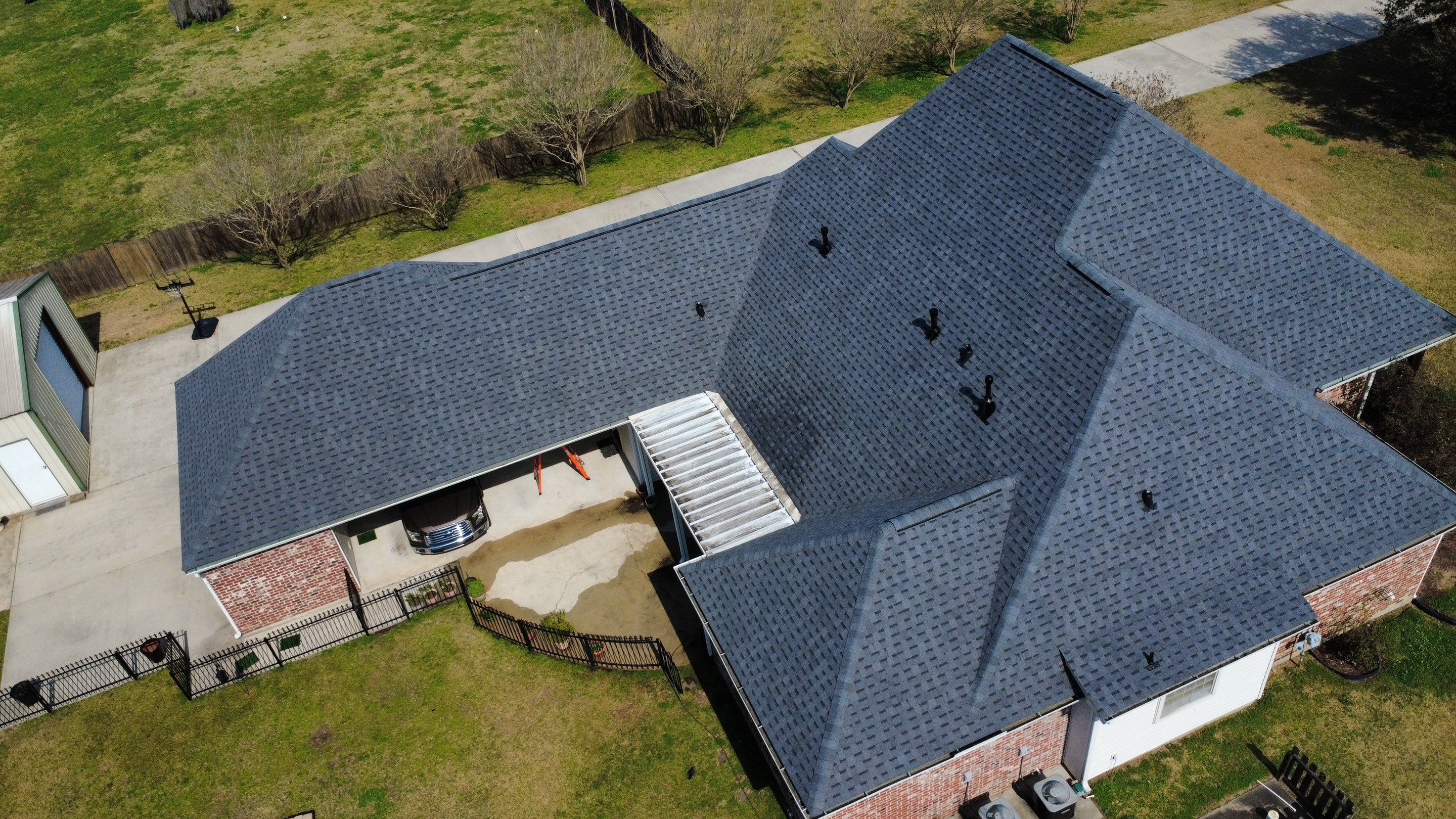 Residential roof installation in Plaquemine, LA using Atlas Pinnacle Pristine Pewter shingles  by Top Team Roofing & Construction