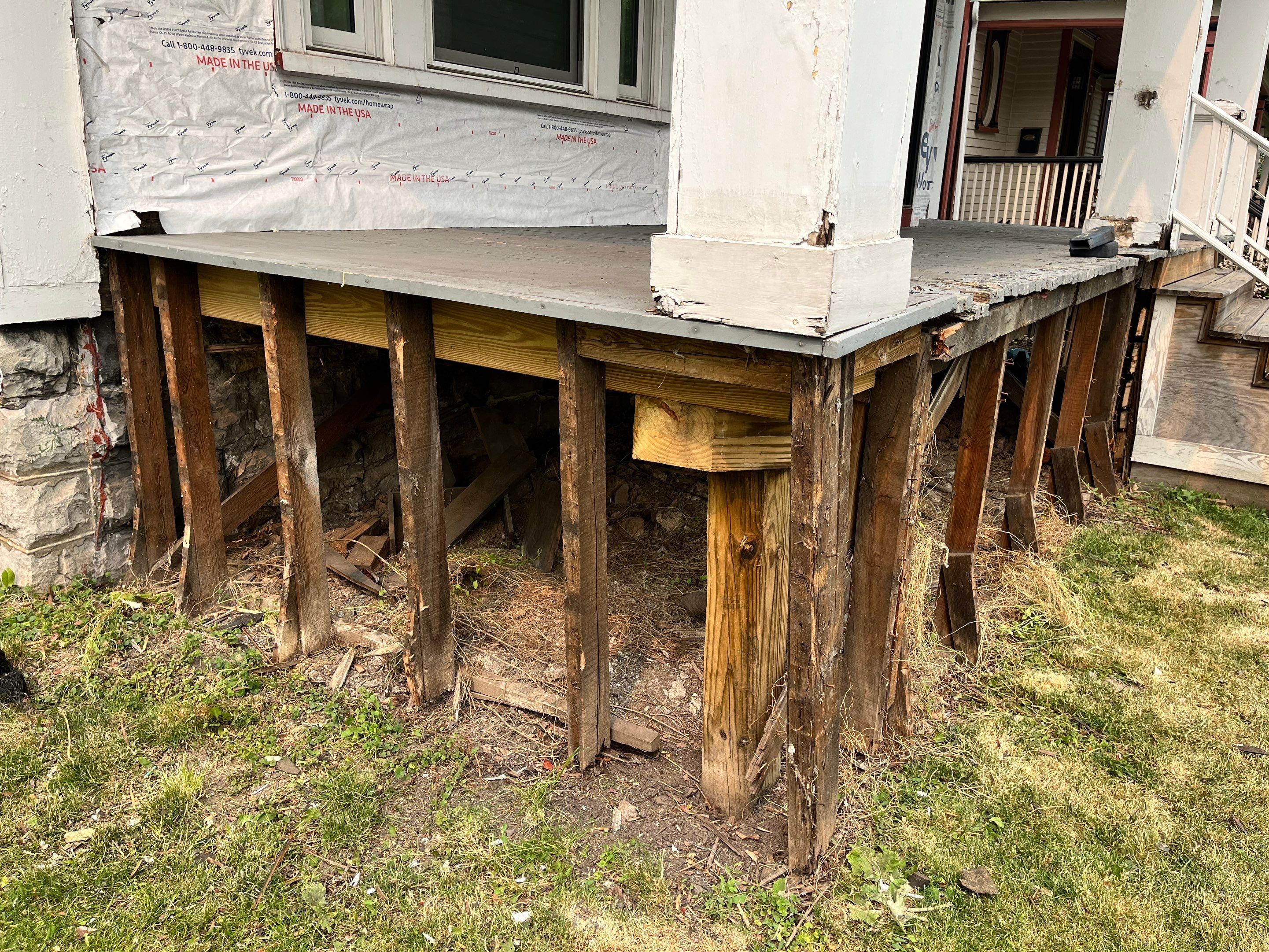 Exterior Renovations- Siding, Stamped Concrete, Porch, and Railings by Ivy Lea Construction
