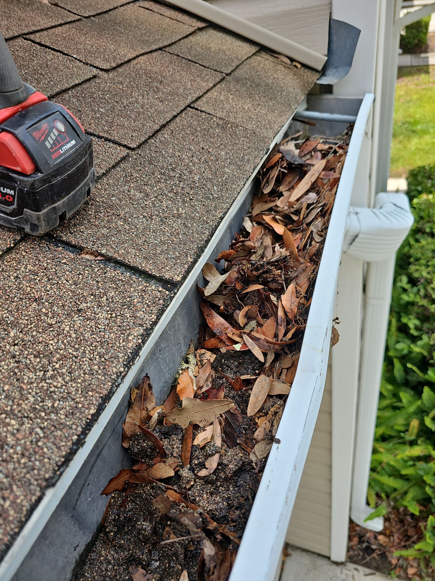 HOA gutter cleaning in Pinehurst & Southern Pines, NC,before  photo showing full gutters.