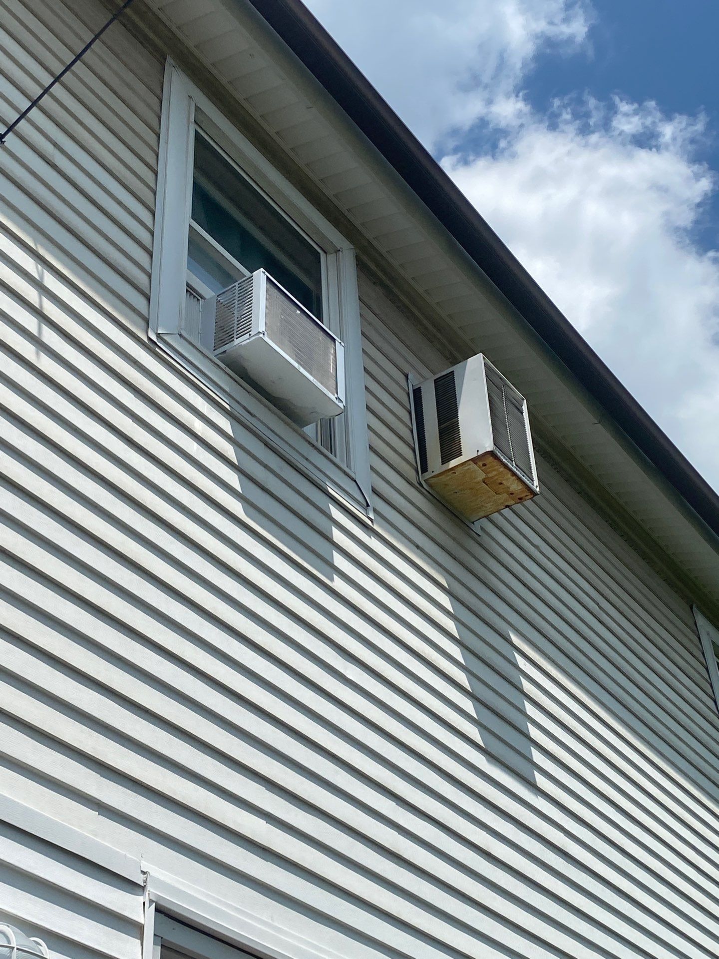 White siding  by Cousins Roofing Siding & Decks