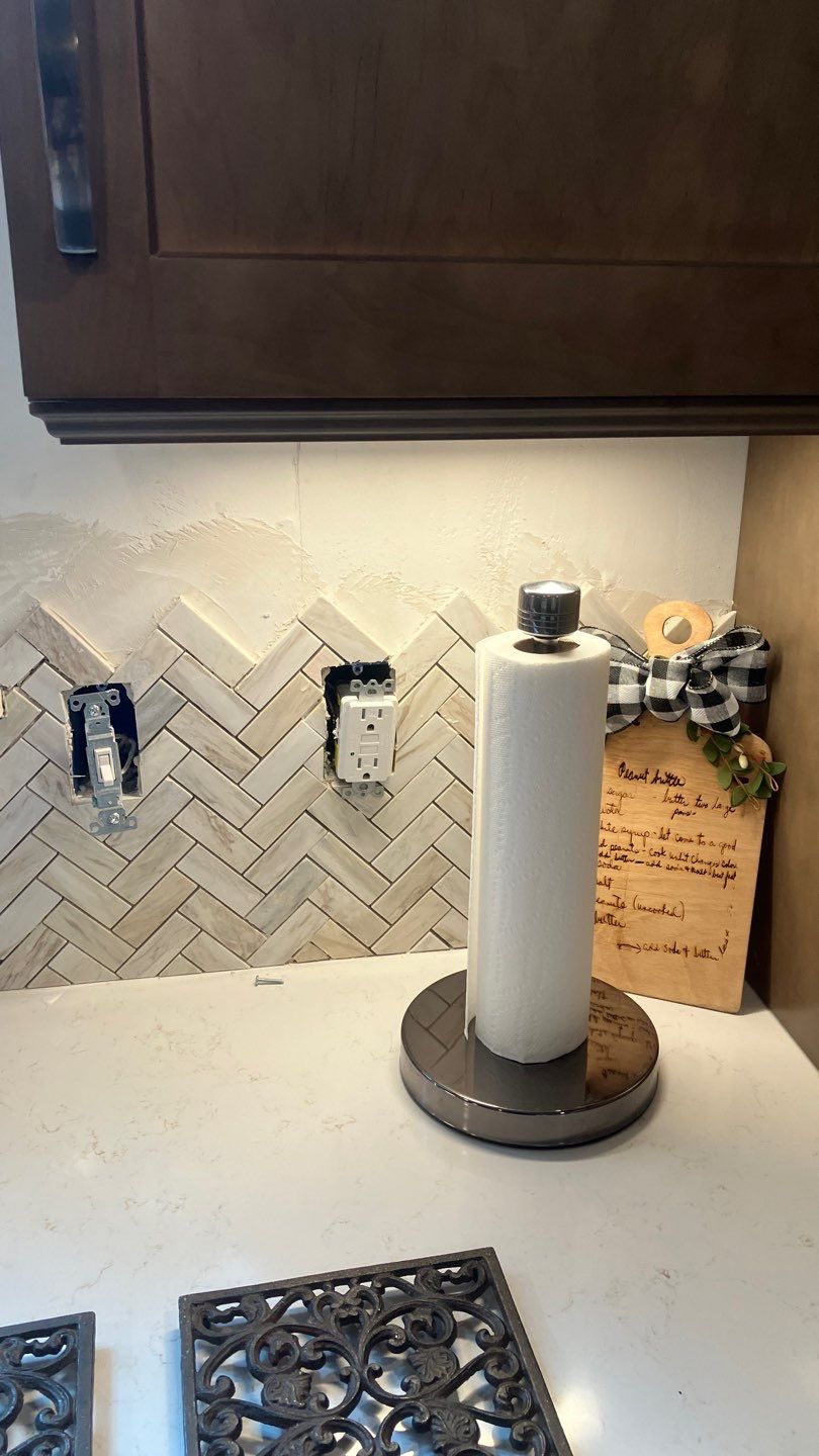 Beautiful Herringbone Backsplash  by Footprints Floors of Nashville