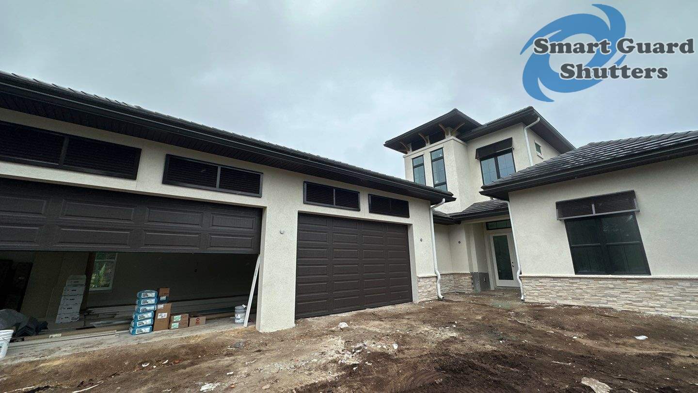 Decorative Bahama Shutters in Grey Brown by Smart Guard Shutters