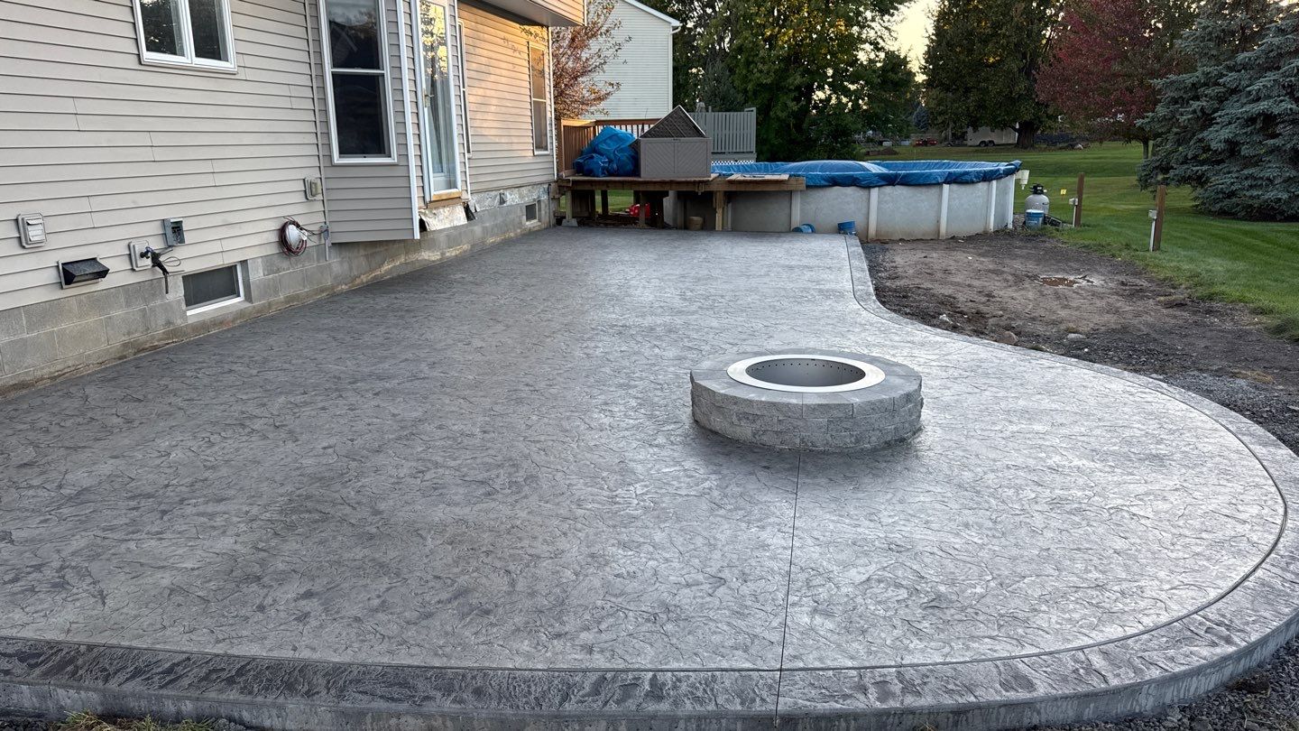 Oxford slate stamped concrete patio by NG Masonry & Construction LLC
