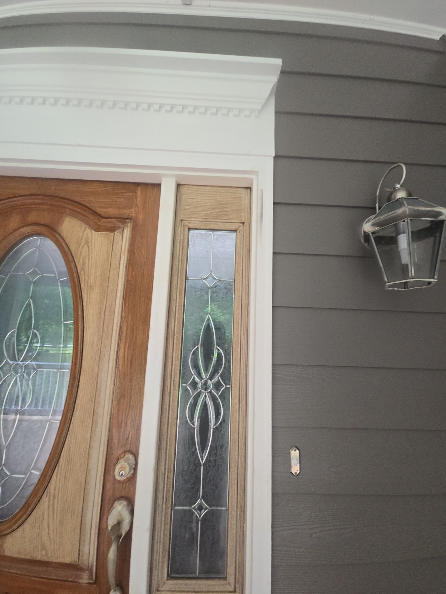 Siding replacement, exterior painting, and front door staining. by GonzalezPainters & Contractors Inc