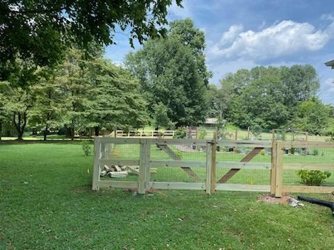 Fence Installation of 3 Rail Ranch with Wire Backing by Titans of Timber Fence & Stain