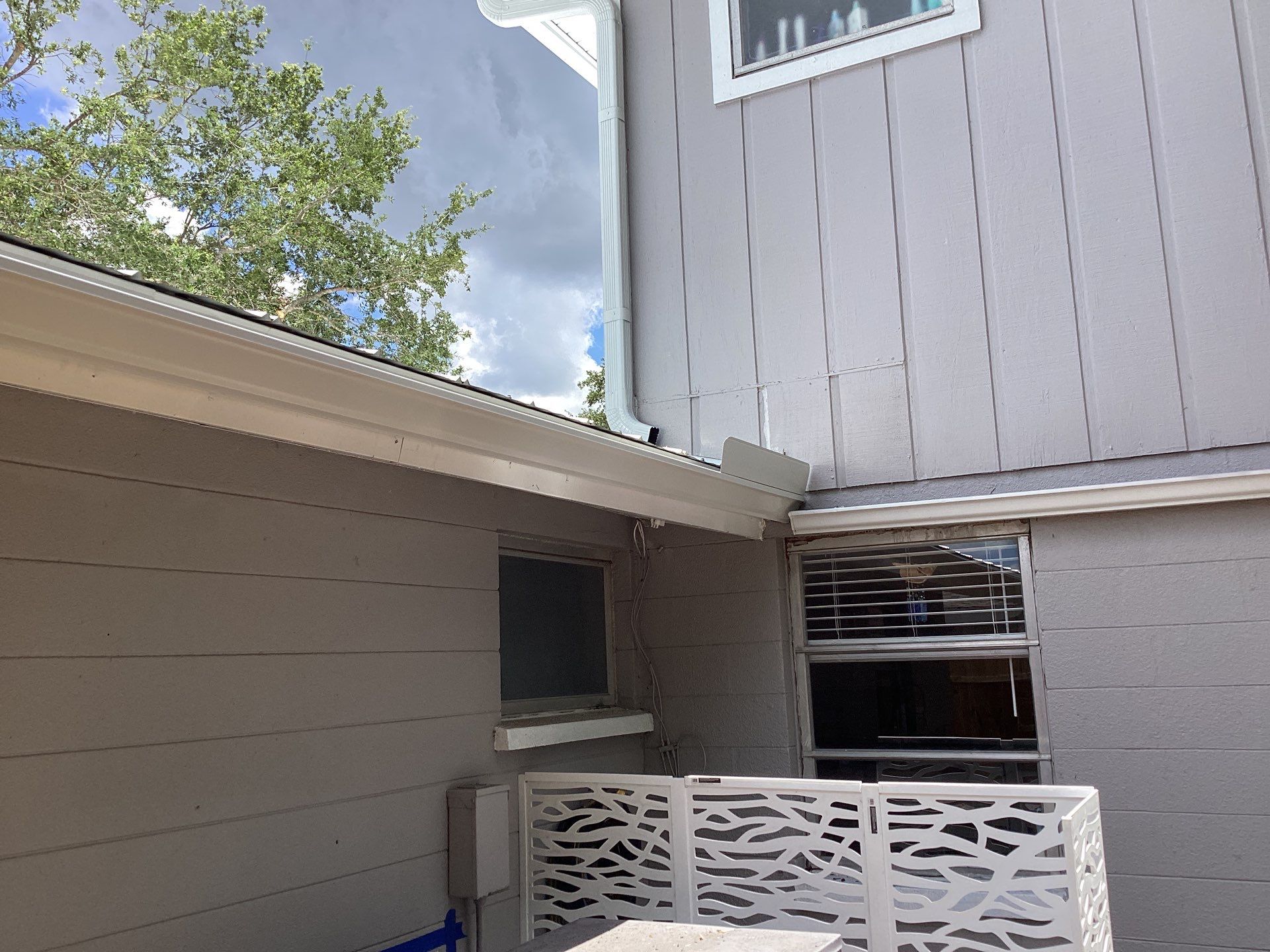 White K Style Seamless Gutters using 3X4 Elbow Downspout in Sarasota FL by Gutter Professors