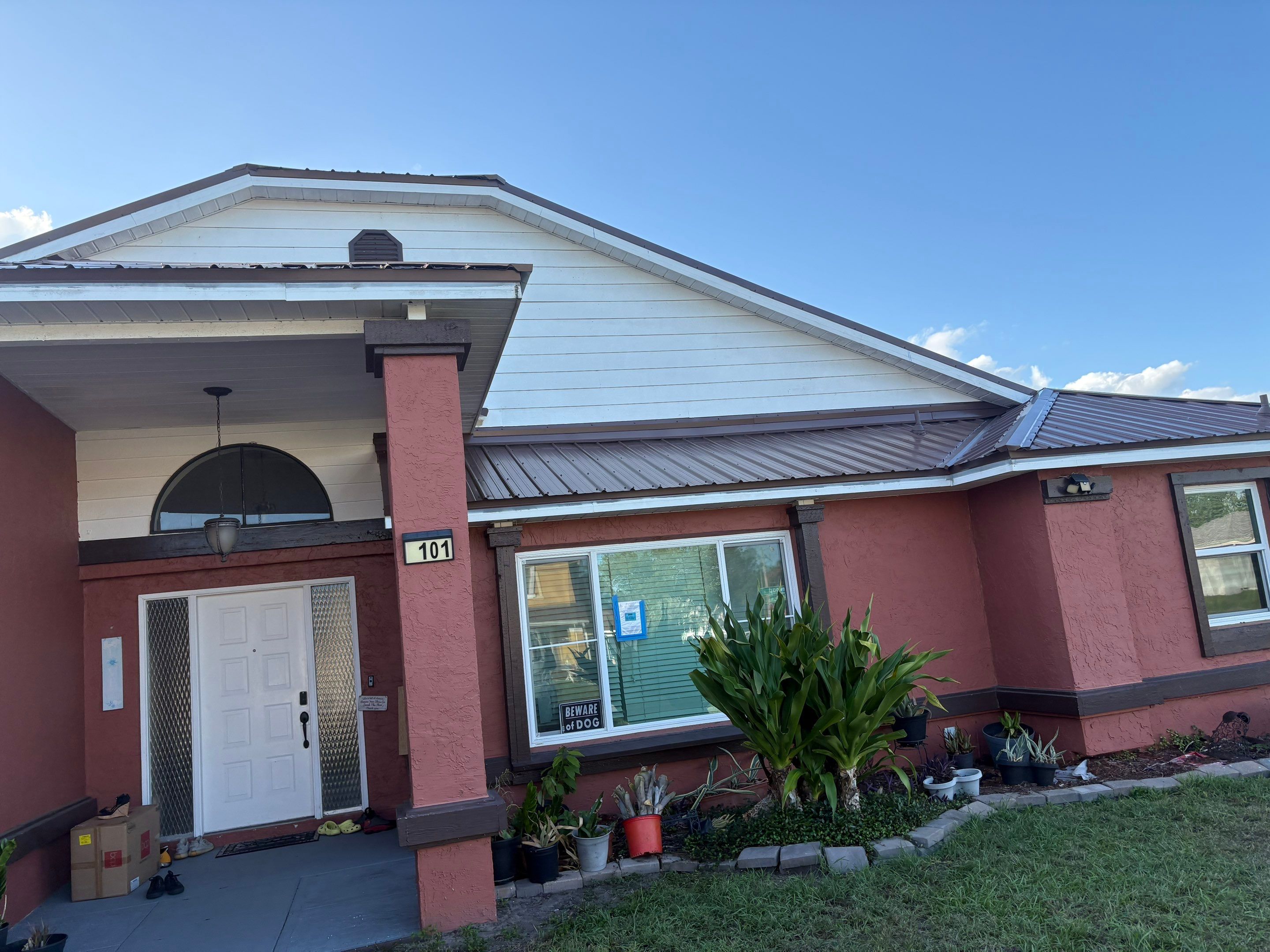 Residential Metal Roofing Installation and Gutter Replacement in Kissimmee by Pinnacle Roofing Group