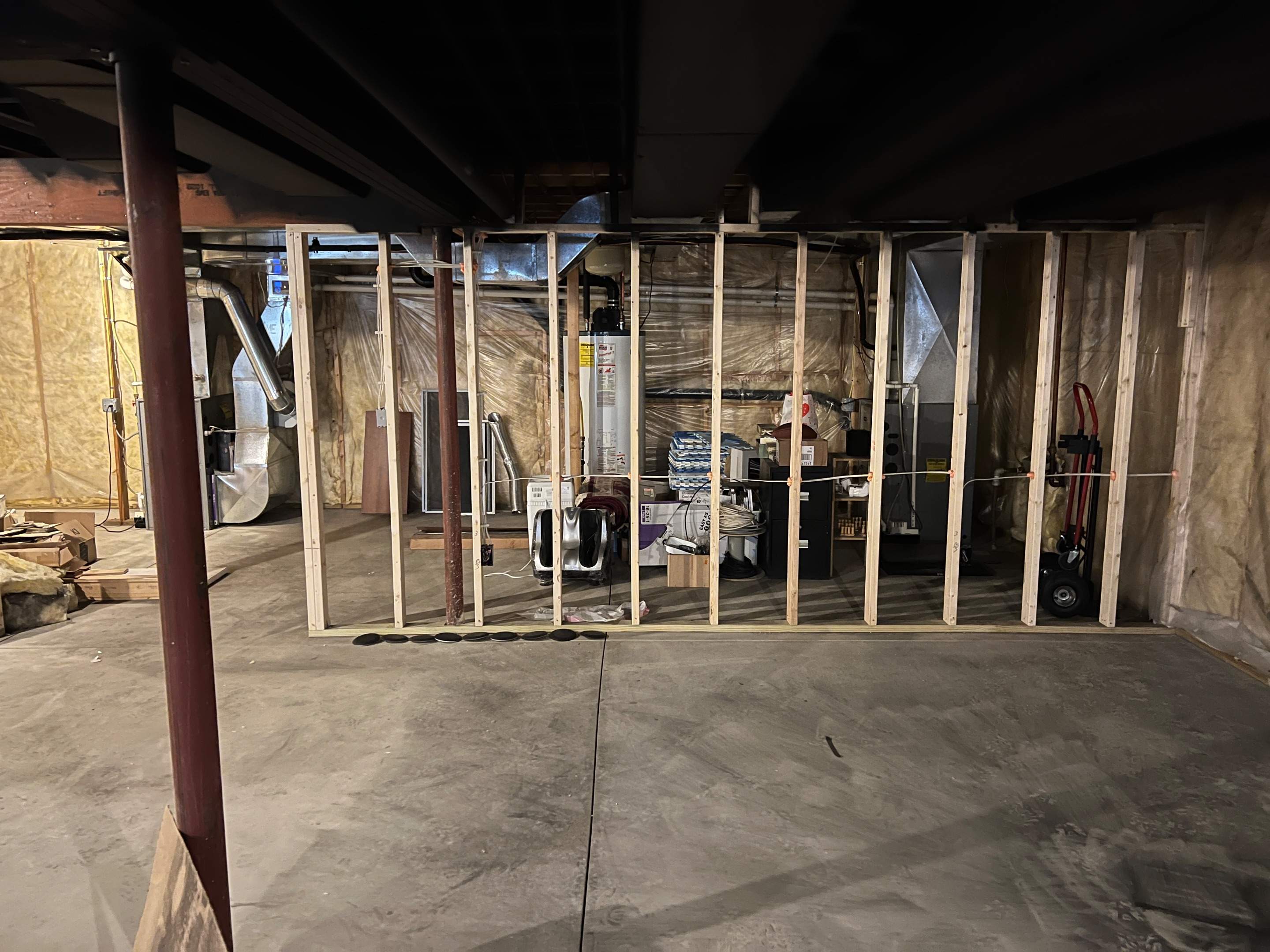 Basement Remodel w/ LVP Flooring & Exposed Ceiling by Chagnon Building & Remodeling LLC