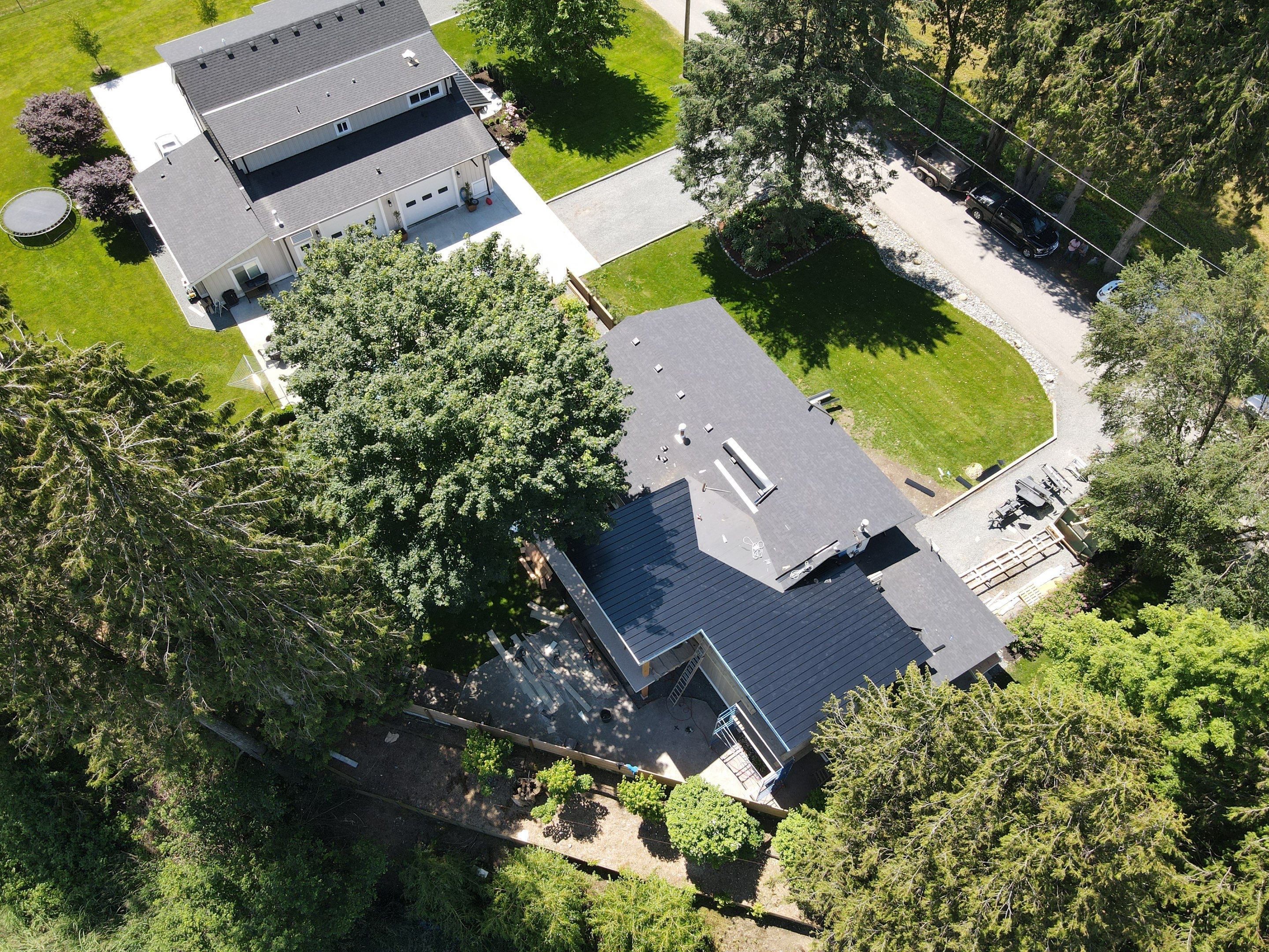 Residential Roofing Installation using 12" Prolok metal, shingles and Torch on roofing by Top Notch Roofing Inc