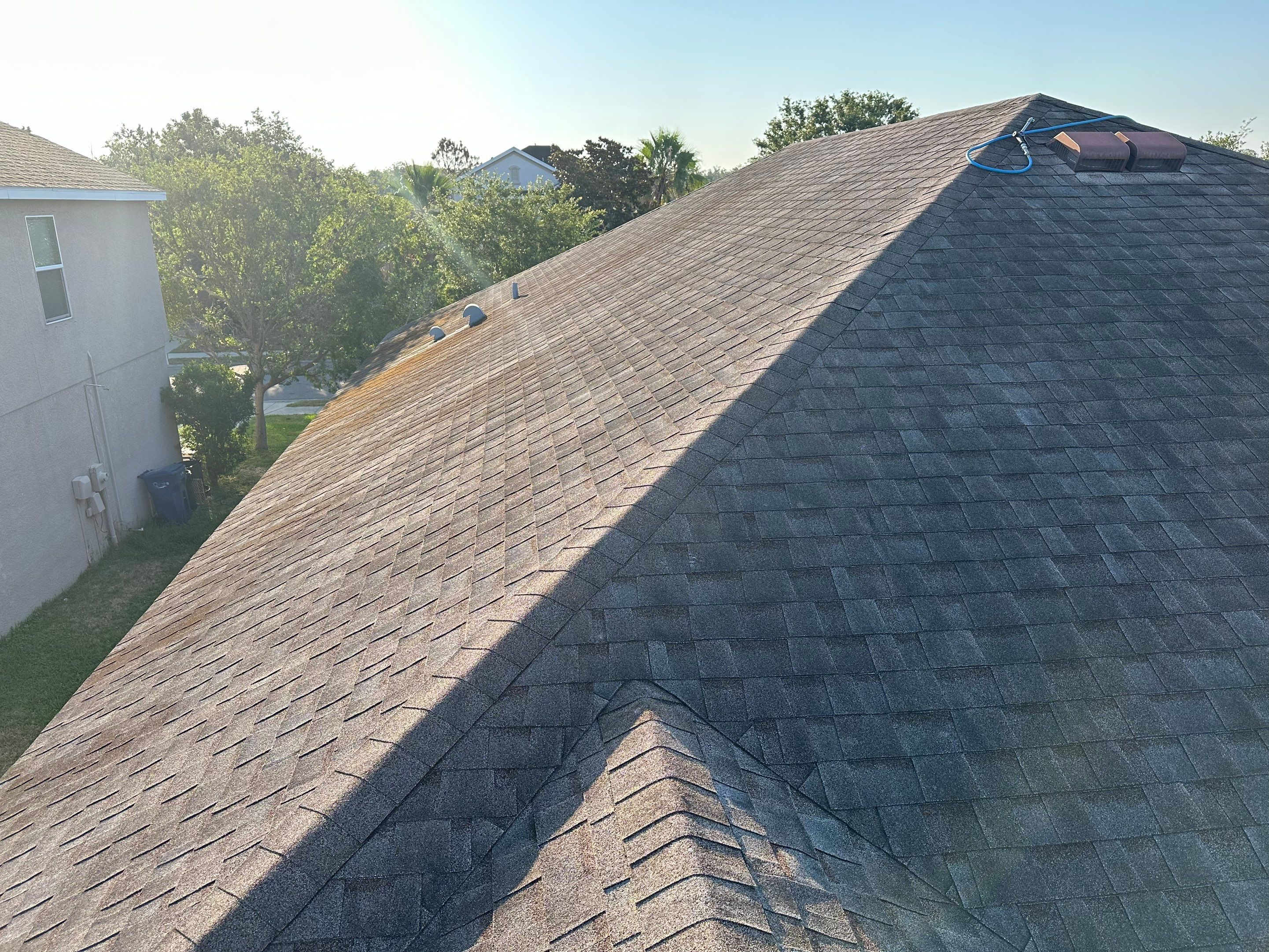 Asphalt Shingle Roof Soft Wash Cleaning & Concrete Pressure Washing in CopperStone Community, Parrish, FL by Sunshine AquaWash
